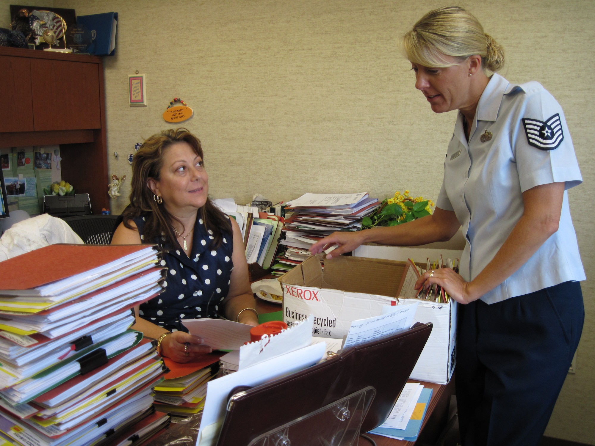 Elisa Horrach, contracting officer, and Tech. Sgt. Angie Matson, contract specialist, prepare Eglin files for end of year review at the 96th Contracting Squadron Sept. 28. More than 95 service contracts expired or went up for rebid Sept. 30 when the base wrapped up its close out budget strategy and began preparation to execute new funds for fiscal year 2010. (U.S. Air Force photo/Chrissy Cuttita)
