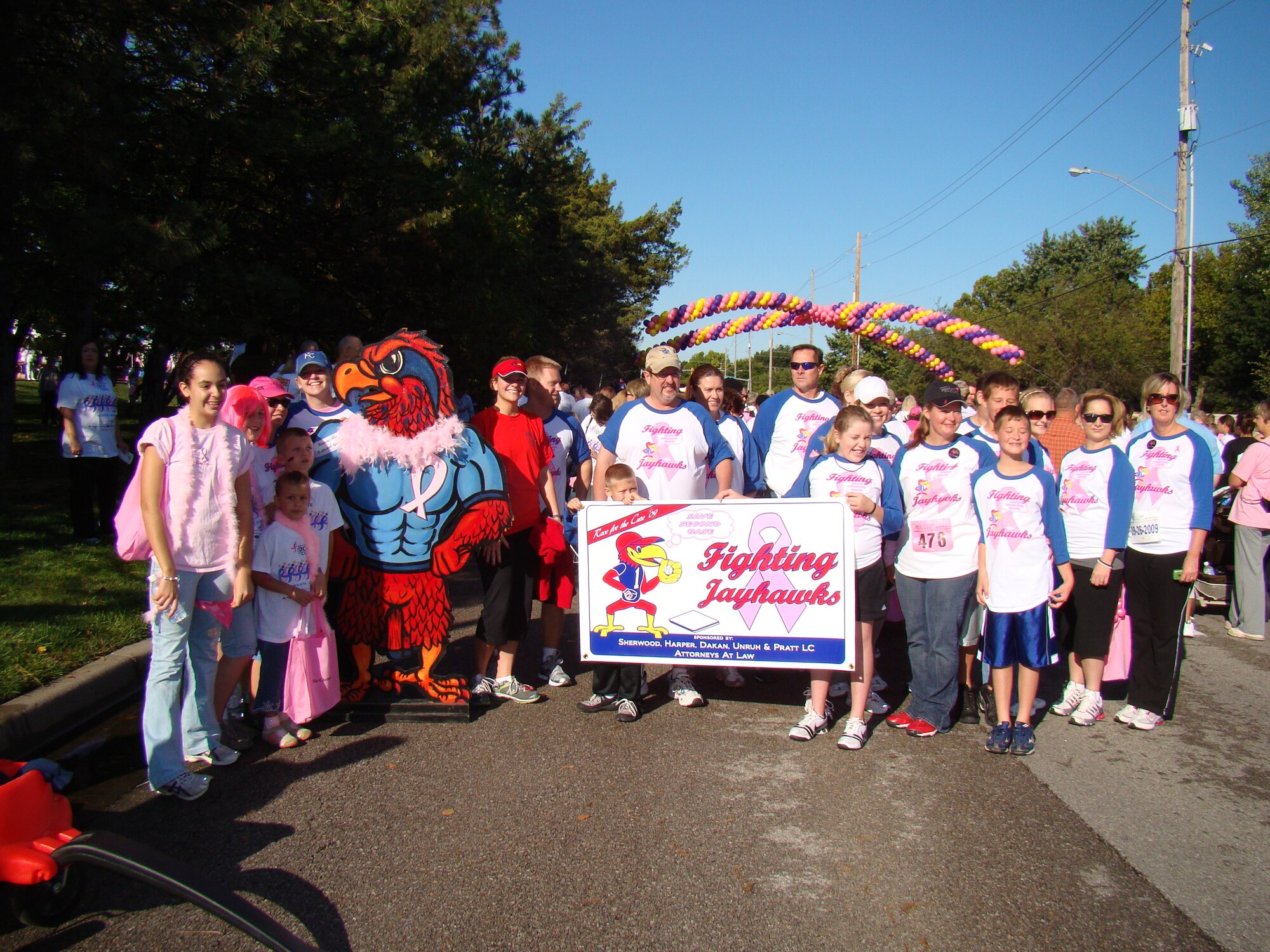 Members of the Fighting Jayhawks at the starting line of the 1-mile walk of the Susan G. Komen Race for the Cure on Septebmer 26th.  The team was the largest out of the 245 assembled at the local race.
