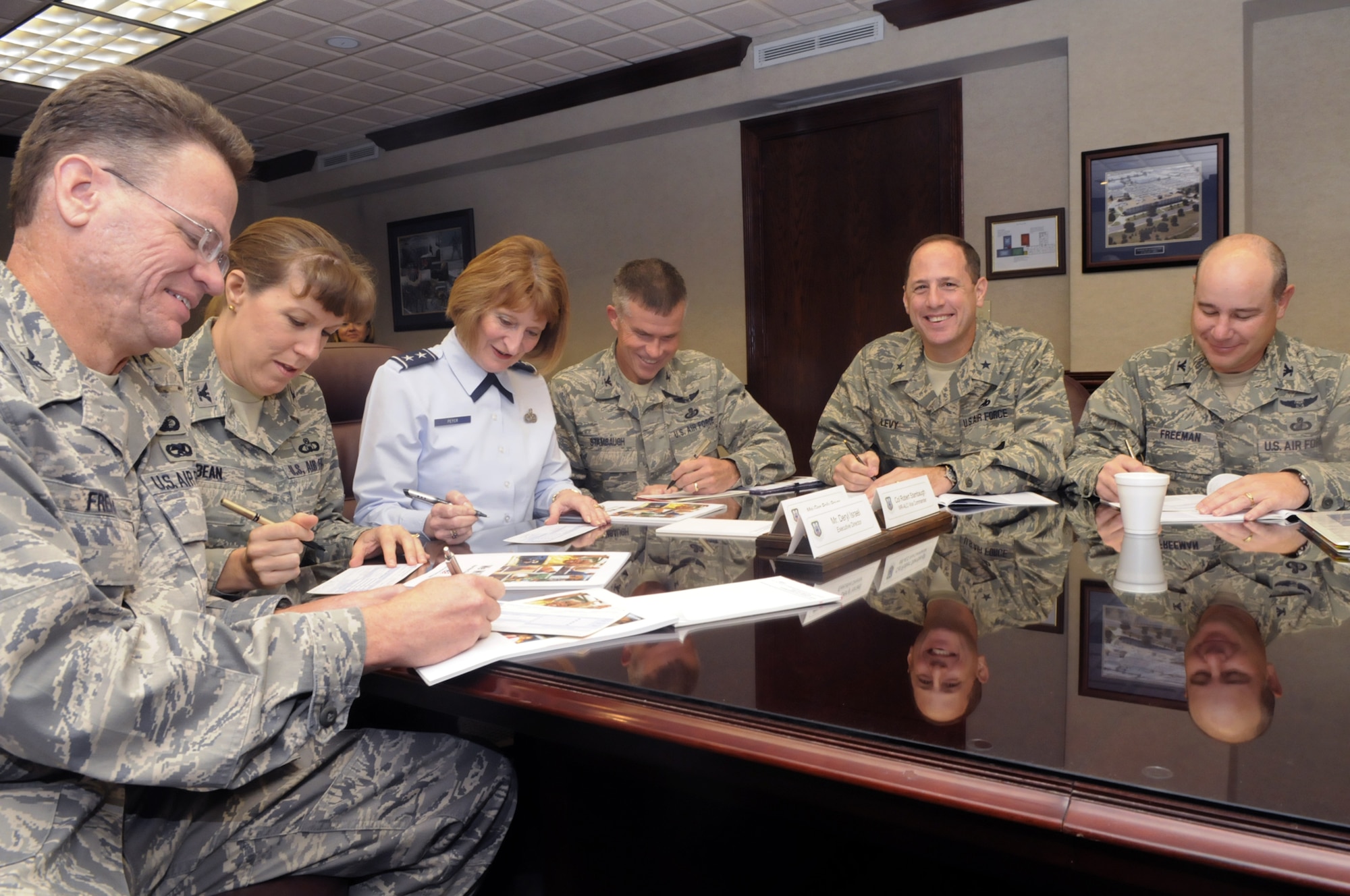 L-R, Col. David French, 542nd CSW vice director, Col. Debra Bean, 78th ABW vice commander, Maj. Gen. Polly Peyer, WRALC commander, Col. Robert M. Stambaugh, WRALC vice commander, Brig. Gen. Lee Levy, 402nd MXW commander, and Col. Tim Freeman, 330 ASW commander sign Combined Federal Campaign pledge cards Oct. 1. The CFC campaign will run from Oct. 7 through Nov 13. U. S. Air Force photo by Sue Sapp