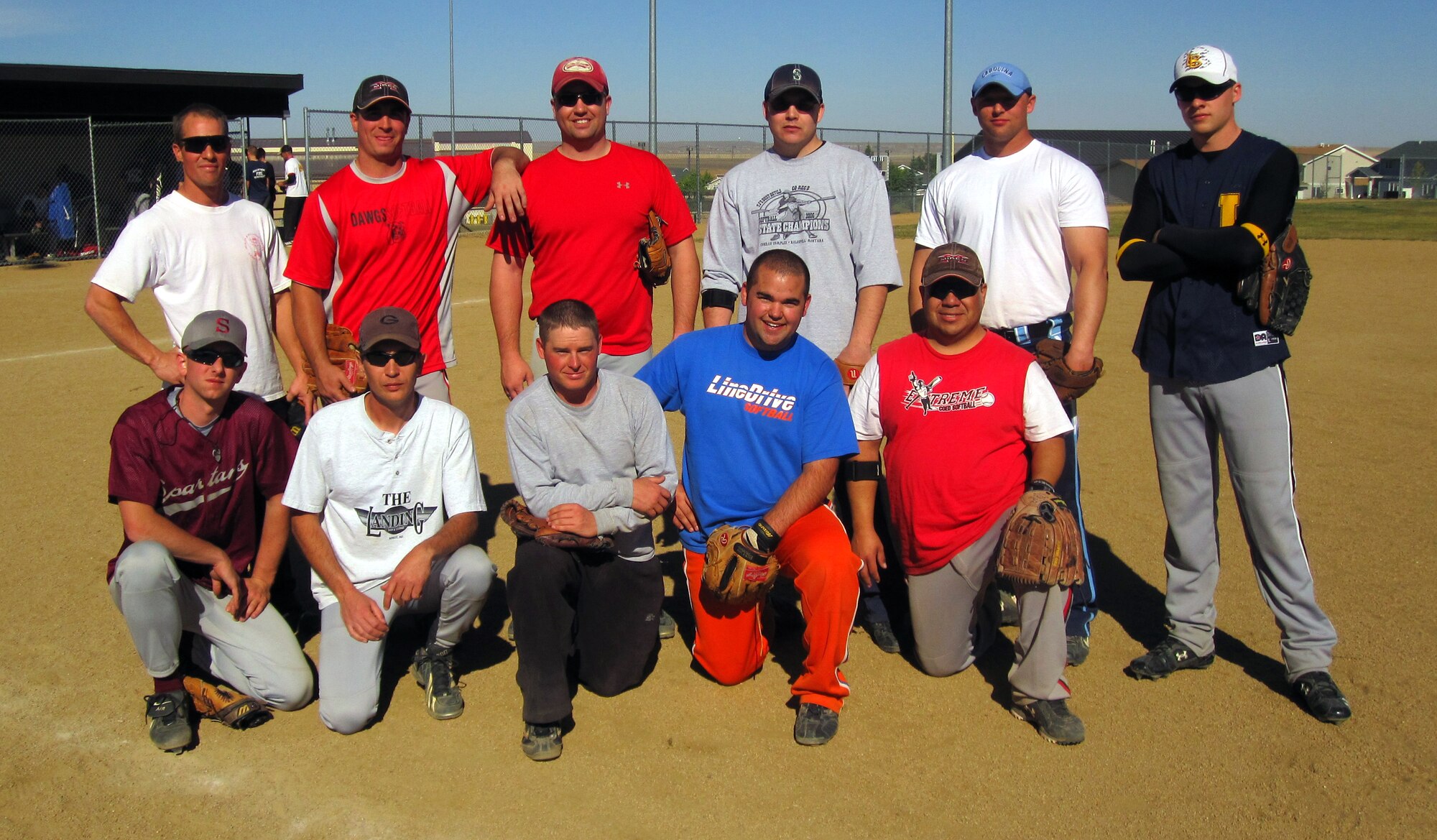 Members of the 341st Maintenance Group softball team pose for a photo after placing first in the Midnight Madness softball tournament held Sept. 26 at softball fields 2 and 3. The games started at 8 p.m. and players continued to rotate through the bullpens until noon the following day. Teams that stayed to play the entire night competed in at least four games in a triple-round robin, then a single elimination tournament.
A home-run derby was also held at 2 a.m. Staff Sgt. Carl Snedeker, 341st Maintenance Operations Squadron, was the winner of this competition.
The event was sponsored by the Enforcing Underage Drinking Laws Grant and made the event a success that "would not have been possible," said Senior Airman Cody Walker, 341st Force Support Squadron sports director. EUDL paid for umpires, T-shirts, hamburgers, hotdogs, soda, condiments and propane. (U.S. Air Force photo/Senior Airman Cody Walker)