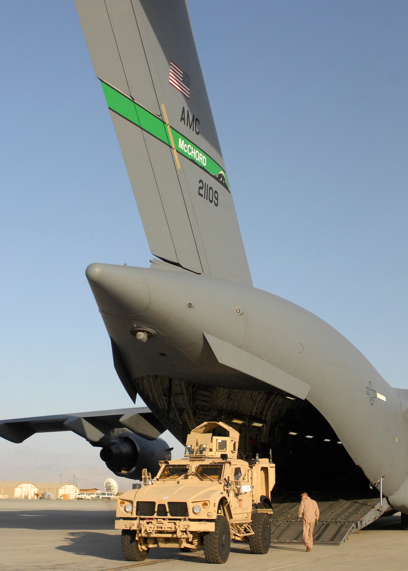A U.S. Air Force C-17 Globemaster III loadmaster inspects a mine-resistant, ambush-protected all-terrain vehicle, or M-ATV, at Bagram Air Field, Afghanistan, on Oct. 1, 2009. The M-ATV's are the first of their kind in Afghanistan and support small-unit combat operations in highly restricted rural, mountainous and urban environments that include mounted patrols, reconnaissance, security, convoy protection, communications, command and control and combat service support. Transporting a load of M-ATVs by U.S. Air Force aircraft can be accomplished in a day, where sealift would require approximately 26 days.  An order for more than 6,600 of the M-ATVs are expected to be fielded over the next year. Three M-ATVs were loaded onto a
C-17 Globemaster III and four onto a C-5 Galaxy at Air Mobility Command's Charleston Air Force Base, S.C., on Sept. 29 and flown to Afghanistan.  The M-ATV is designed to replace the up-armored Humvee in Afghanistan. The M-ATV will carry up to five personnel: four plus a gunner. The C-17 is from McChord Air Force Base, Wash. and was operated by a crew from Charleston AFB, S.C. (U.S. Air Force Photo/Senior Airman Susan Tracy)