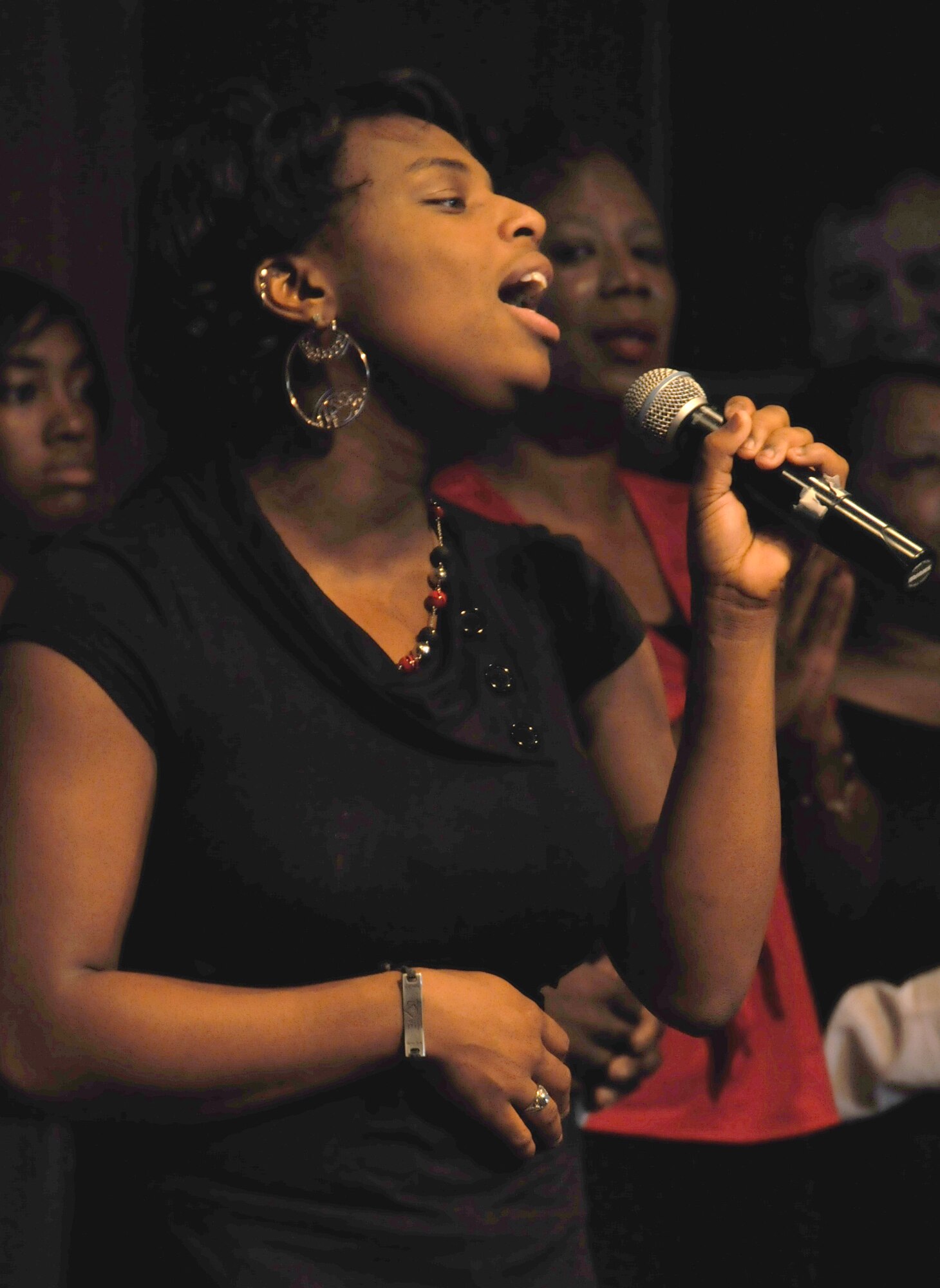 Deetra Louis, 18, daughter of Brian and Dierdre Louis, 81st Comptroller Squadron, sings  Sunday with the mass choir at Triangle Chapel for the gospel service’s 38th anniversary celebration.  (U.S. Air Force photo by Kemberly Groue)