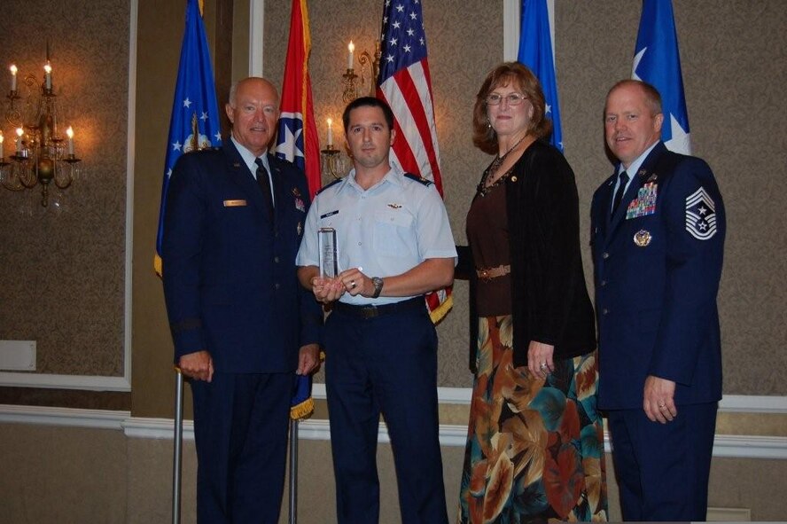 The 129th Rescue Wing was presented the Spaatz Trophy at the 2009 National Guard Association of the United States conference in Nashville, Tenn., Sept. 13. The Spaatz Trophy is named in honor of former Air Force Chief of Staff, Gen. Carl A. Spaatz, and is presented to the overall outstanding flying unit in the Air National Guard. Pictured with the award (from right to left): Gen. Harry M. Wyatt III, director of the Air National Guard, Maj. Michael Wagle, 129th Rescue Wing MC-130P Combat Shadow pilot, Maj. Gen. (retired) Cindy Kirkland, former Nevada Adjutant General and NGAUS vice chair (Air), and Chief Master Sgt. Christopher Muncy, Air National Guard command chief. (Courtesy of the Air National Guard)