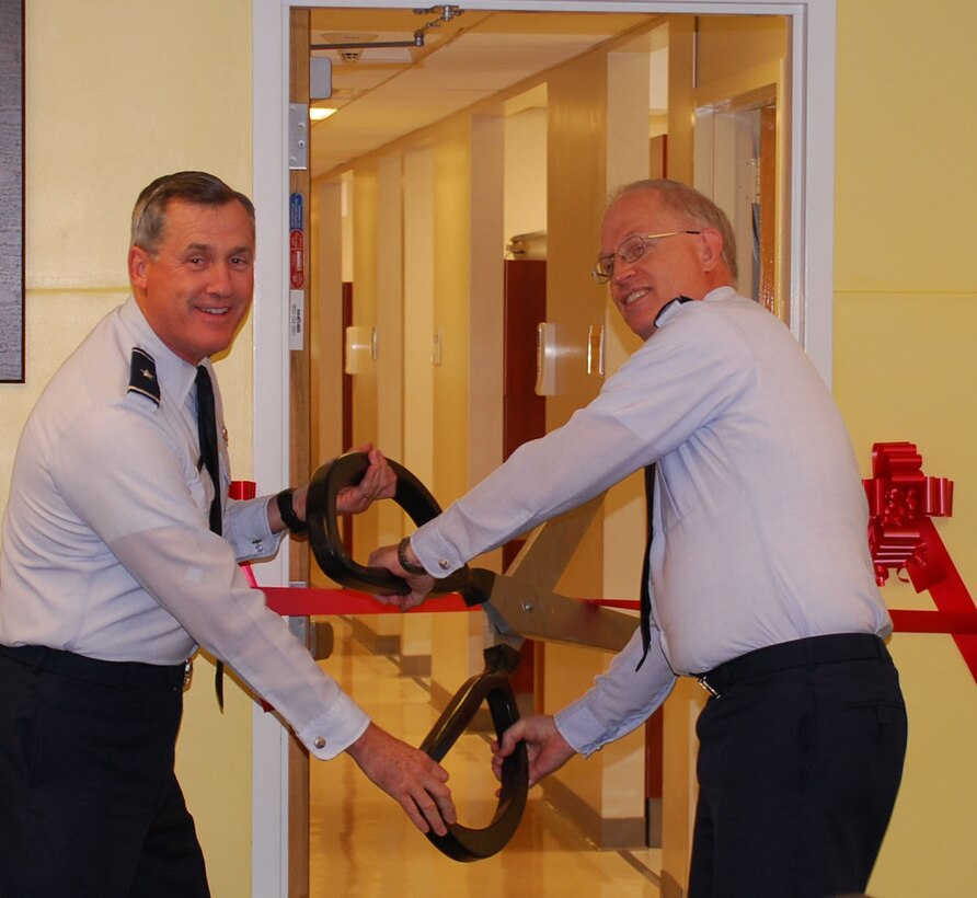 Brig. Ben O.G. Mannon, 82nd Training Wing commander and Col. William Pierpont, 82nd Dental Squadron commander, cut the ribbon opening the new dental officers recidency suite. The facility will greatly improve graduate numbers from the program as well as better care for Sheppard members. (U.S. Air Force photo/ Airman 1st Class Matthew Varga)