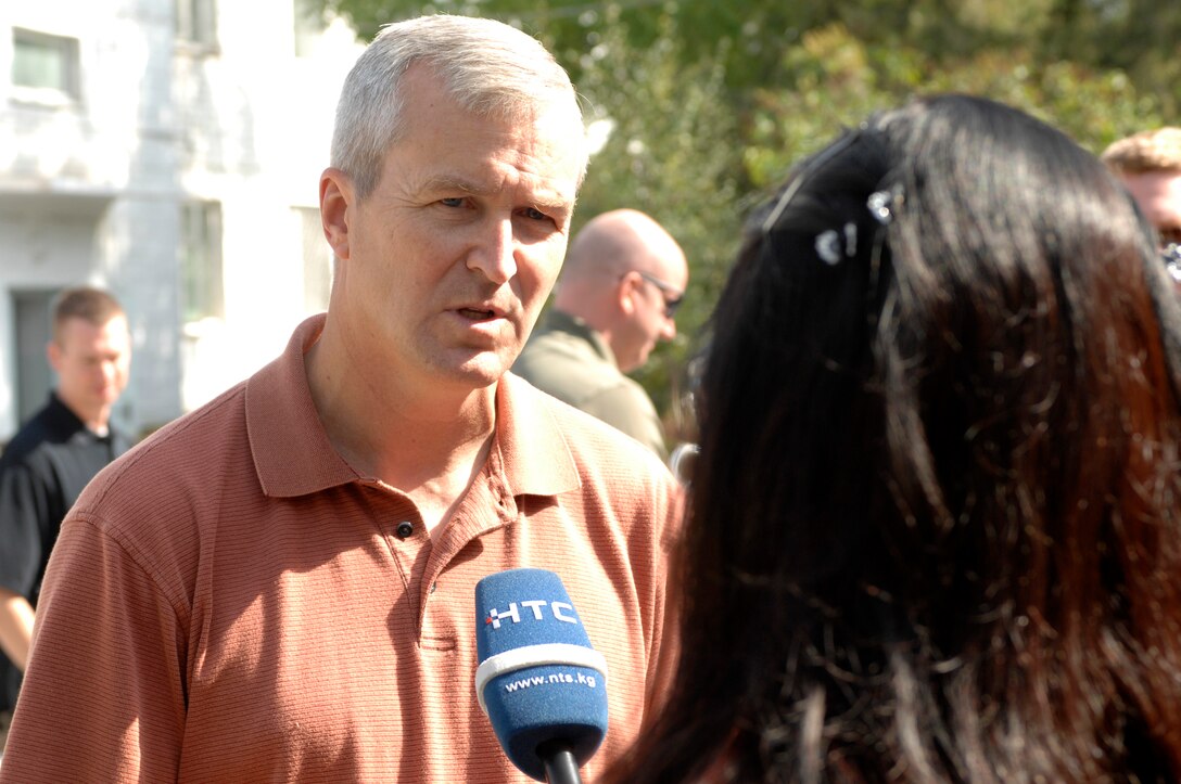 BISHKEK, Kyrgyzstan -- Lt. Col. Larry Lang, U.S. Air Forces Central Command 'Falcon' Band director, is interviewed by local media before a performance in Bishkek. Colonel Lang and the 'Falcon' Band members are stationed at a base in Southwest Asia and are deployed from Offutt Air Force Base, Neb. (U.S. Air Force photo/Senior Master Sgt. Andrew E. Lynch)