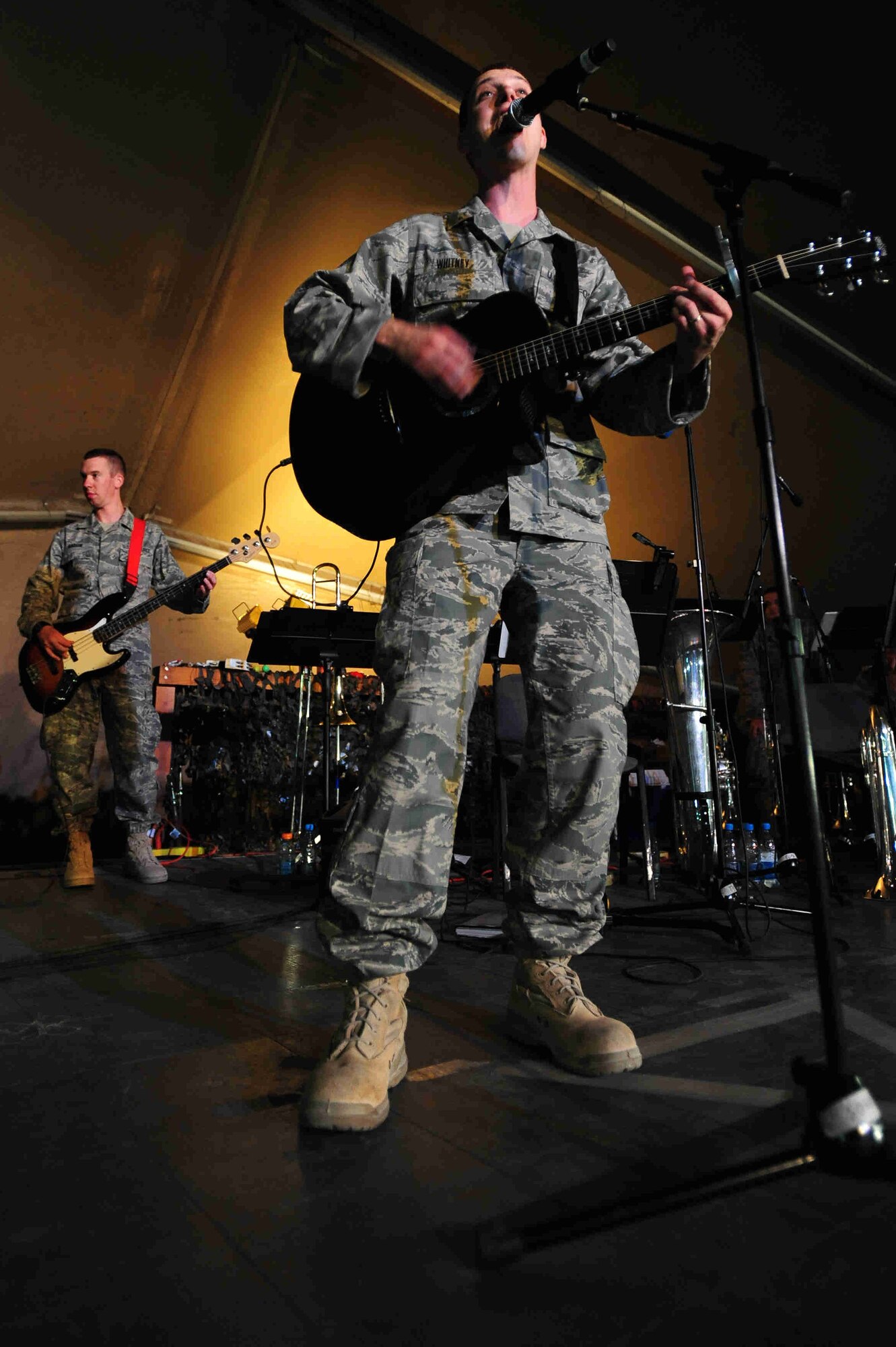 TRANSIT CENTER AT MANAS, Kyrgyzstan -- Staff Sergeants Clinton Whitney and Benjamin Kadow, U.S. Air Forces Central Command 'Falcon' Band musicians, perform 'Rock and Roll' during a performance at Manas, Sept. 27, 2009. Sergeants Whitney and Kadow along with fellow 'Falcon' Band members are stationed at a base in Southwest Asia and are deployed from Offutt Air Force Base, Neb. (U.S. Air Force photo/Senior Airman Steele C. G. Britton)