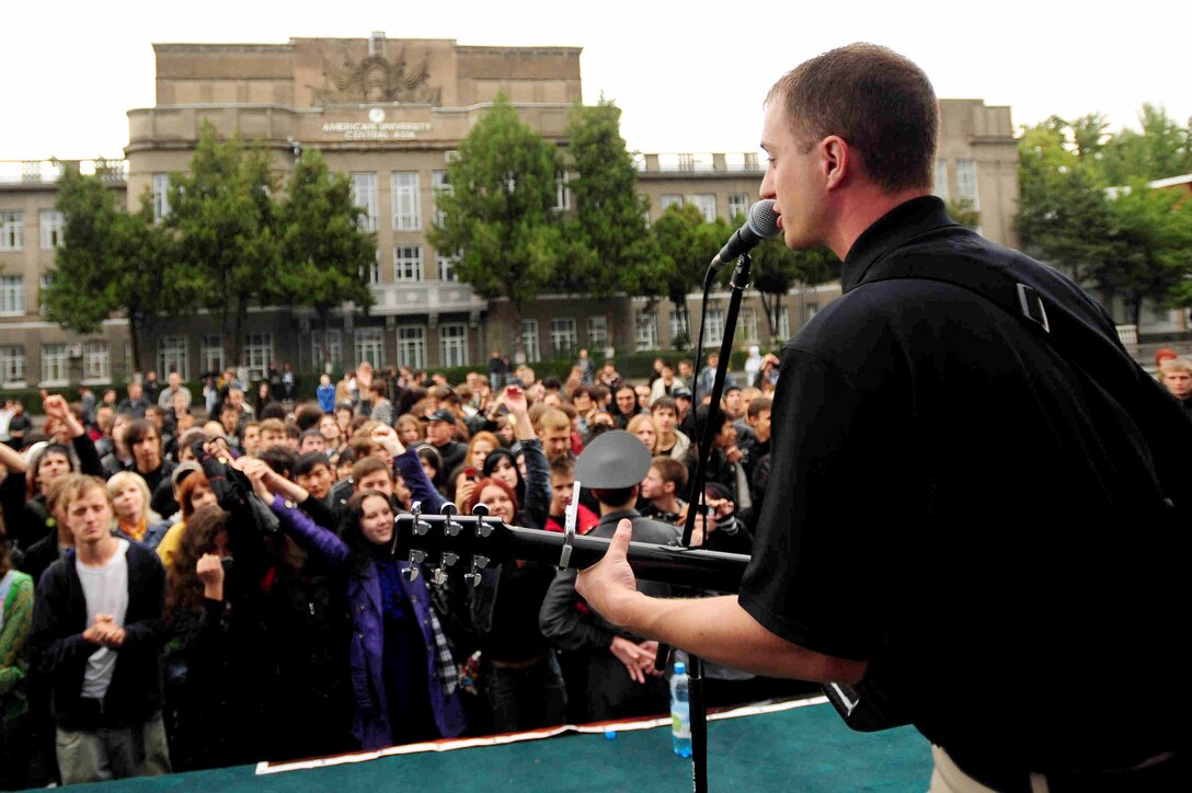 BISHKEK, Kyrgyzstan -- Staff Sgt. Clinton Whitney, U.S. Air Forces Central Command 'Falcon' Band vocalist, performs at the Third-Annual Student Rock Festival at the American University of Central Asia, Sept. 26, 2009. Sergeant Whitney and the 'Falcon' Band members are stationed at a base in Southwest Asia and are deployed from Offutt Air Force Base, Neb. (U.S. Air Force photo/Senior Airman Steele C. G. Britton)