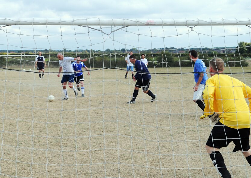 RAF MILDENHALL, England -- Janusz Jaworek, 100th Logistics Readiness Squadron player, attempts to score in an intramural soccer match near the Hardstand Fitness Center here Sept. 30. The 100th LRS defeated the combined 488th Intelligence Squadron/95th Reconnaissance Squadron team after a five-minute overtime session. (U.S. Air Force photo/Senior Airman Thomas Trower)