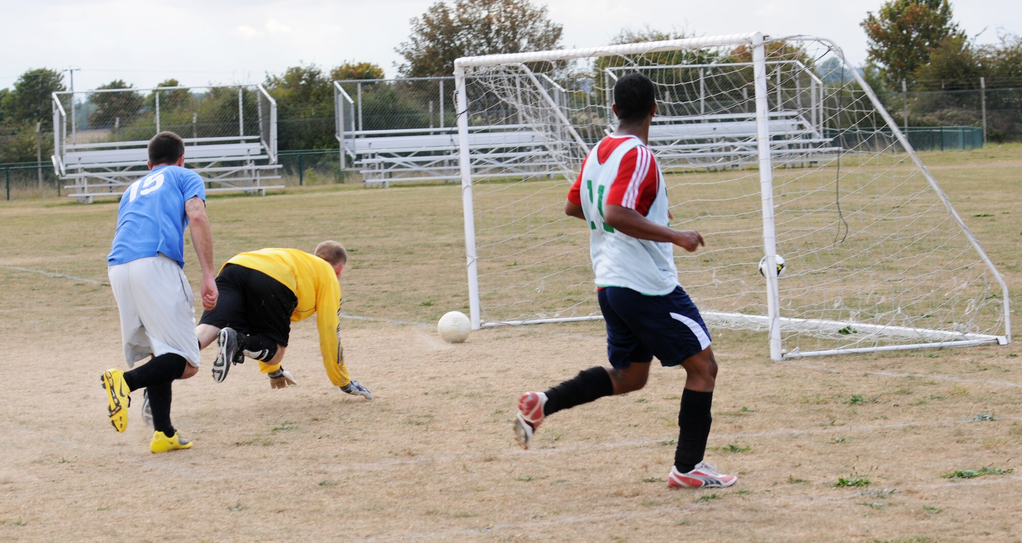 RAF MILDENHALL, England -- Marty Boyl, 94th Reconnaissance Squadron goal keeper, dives to unsuccessfully protect the goal in an intramural soccer match near the Hardstand Fitness Center here Sept. 30. After keeping pace with the 100th Logistics Readiness Squadron in regular play, the combined 488th Intelligence Squadron/95th RS team was unable to keep up in overtime and lost the game 3-6. (U.S. Air Force photo/Senior Airman Thomas Trower)