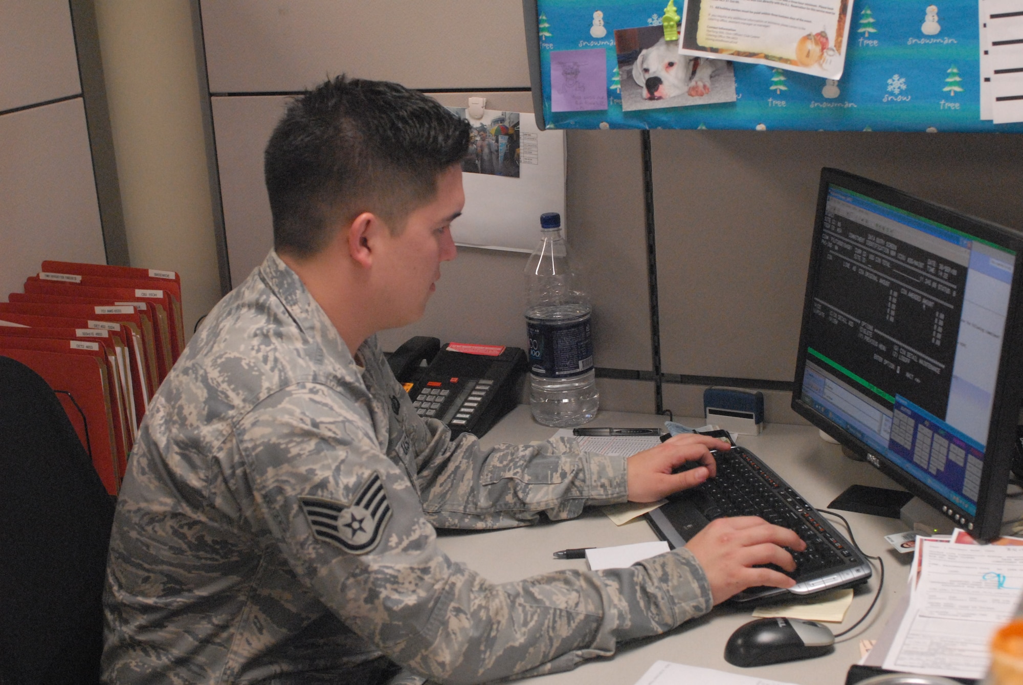 Staff Sgt. Mitchell Schook, 51st Comptroller Squadron, works on fiscal year-end issues at Osan Air Base Sept. 30. Fiscal year closeout requires finance personnel and other base agencies to work together to ensure a unit's budget is entirely allocated. (U.S. Air Force photo by 1st Lt. Chris Hoyler)