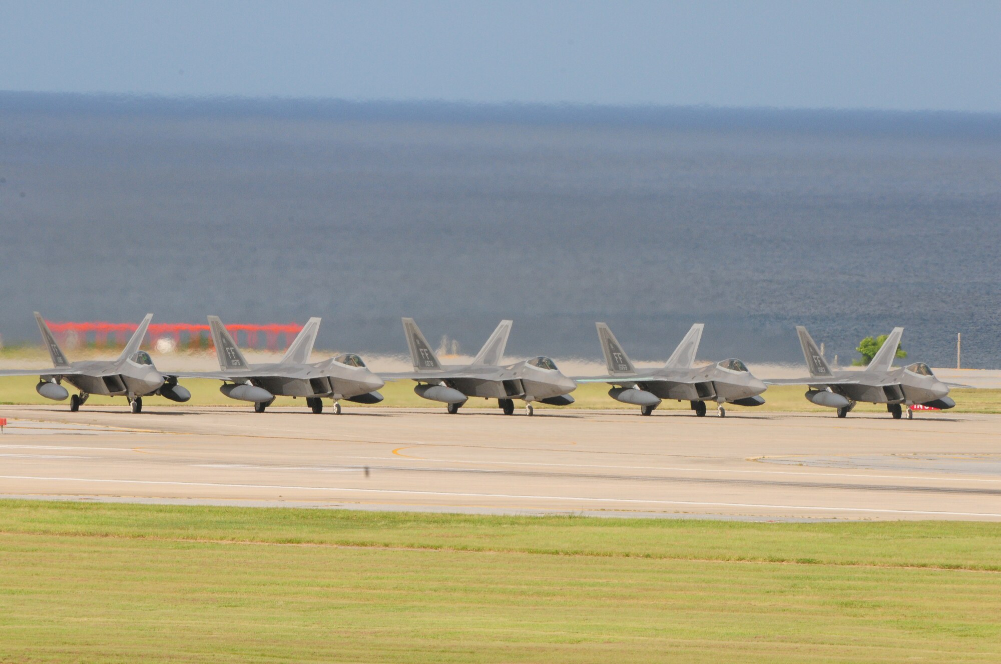 Ten F-22A Raptors assigned to the 94th Expeditionary Fighter Squadron completed a deployment to Kadena and departed, with tanker support from various Pacific locations, for their home station at Langley Air Force Base, Va, Oct.1. While at Kadena, the aircraft conducted training in order to fulfill U.S.security obligations in the region and to accomplish essential Air Force training requirements.
(U.S. Air Force photo/Staff Sgt. Lakisha A. Croley)
