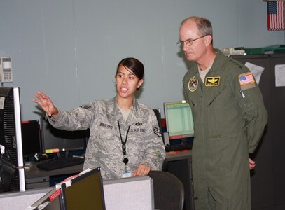 Gen. Kevin P. Chilton, commander, U.S. Strategic Command, is briefed by Staff Sgt. Roselyn Bourand, Communications Focal Point, 373rd Support Squadron, during his visit to the Misawa Security Operations Center, Misawa Air Base, Japan.