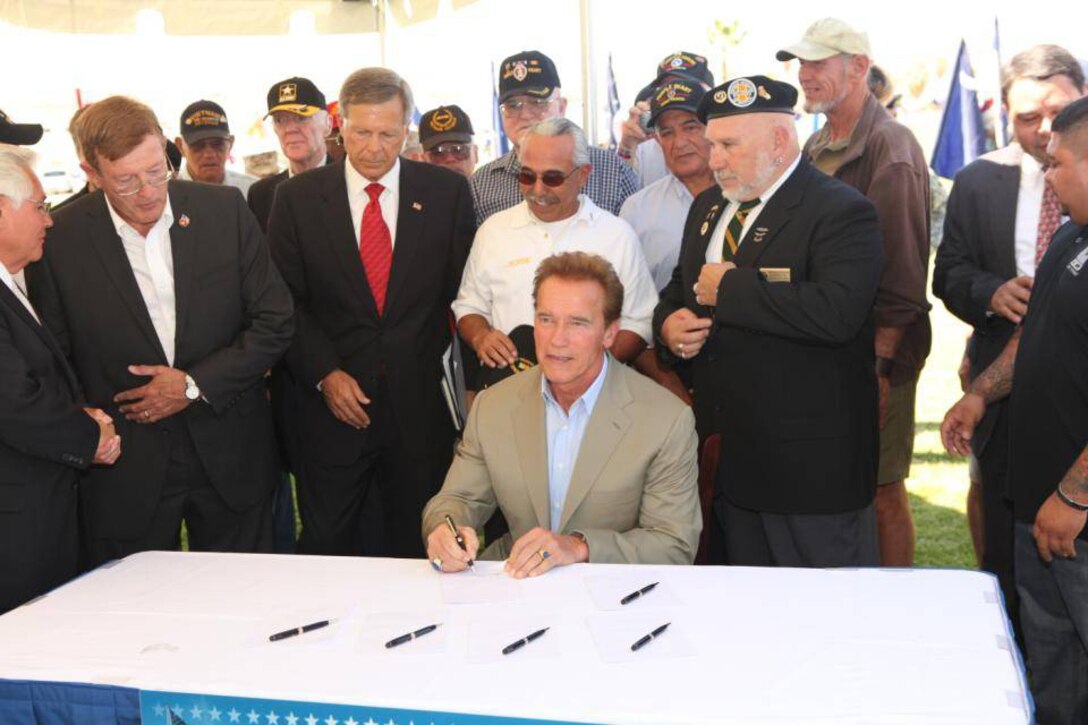 Arnold Schwarzenegger, the governor of California, signs legislation annually declaring March 30 as "Welcome Home Vietnam Veterans Day" throughout the state of California at Lance Cpl. Torrey L. Gray Field here Sept. 25.