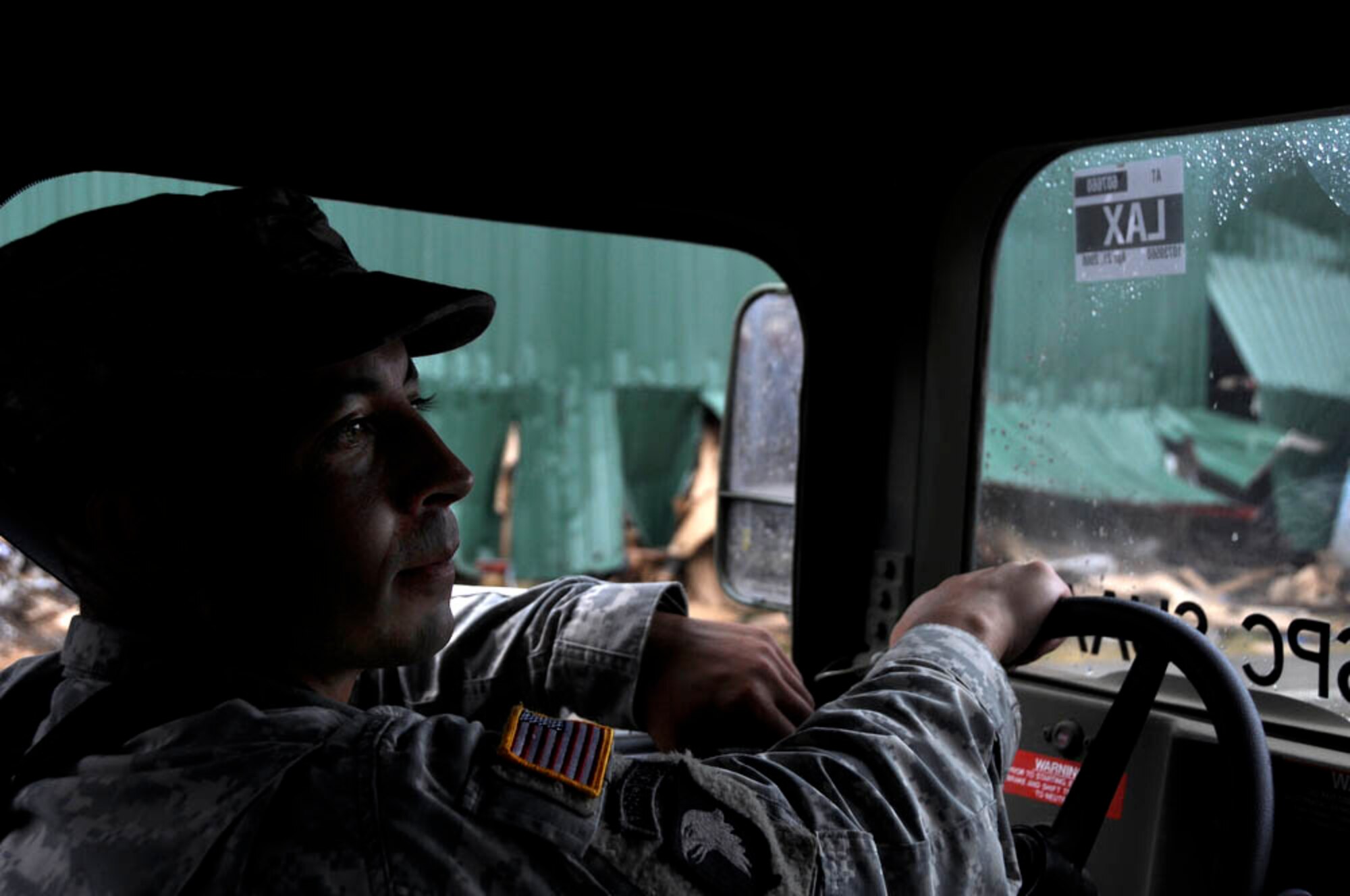 PAGO PAGO - Honolulu, HI native and 93rd Civil Support Team, U.S. Army National Guardsmen 1Lt. Mike Kennedy drives through the damaged areas of Pago Pago, American Samoa on Oct. 1, 2009 after a tsunami caused a great amount of structural damage to the island and it's villages Sept. 30, 2009. (U.S.  Air Force photo/Tech Sgt. Cohen A. Young)