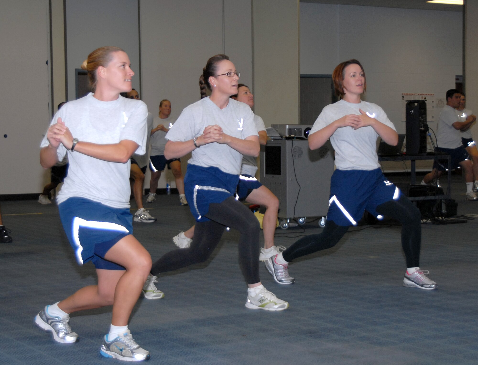 From left, Tech. Sgt. Leila Brice, SC; Master Sgt. Lisamichelle Hughes-Belt, DPP, and Tech. Sgt. Jesse Quick, SC, participate in ARPC's new fitness program at the Buckley Annex. ARPC officials kicked off the new program Oct. 1, which will occur twice a week at the Center. (U.S. Air Force photo/Dwayne Beuthel)