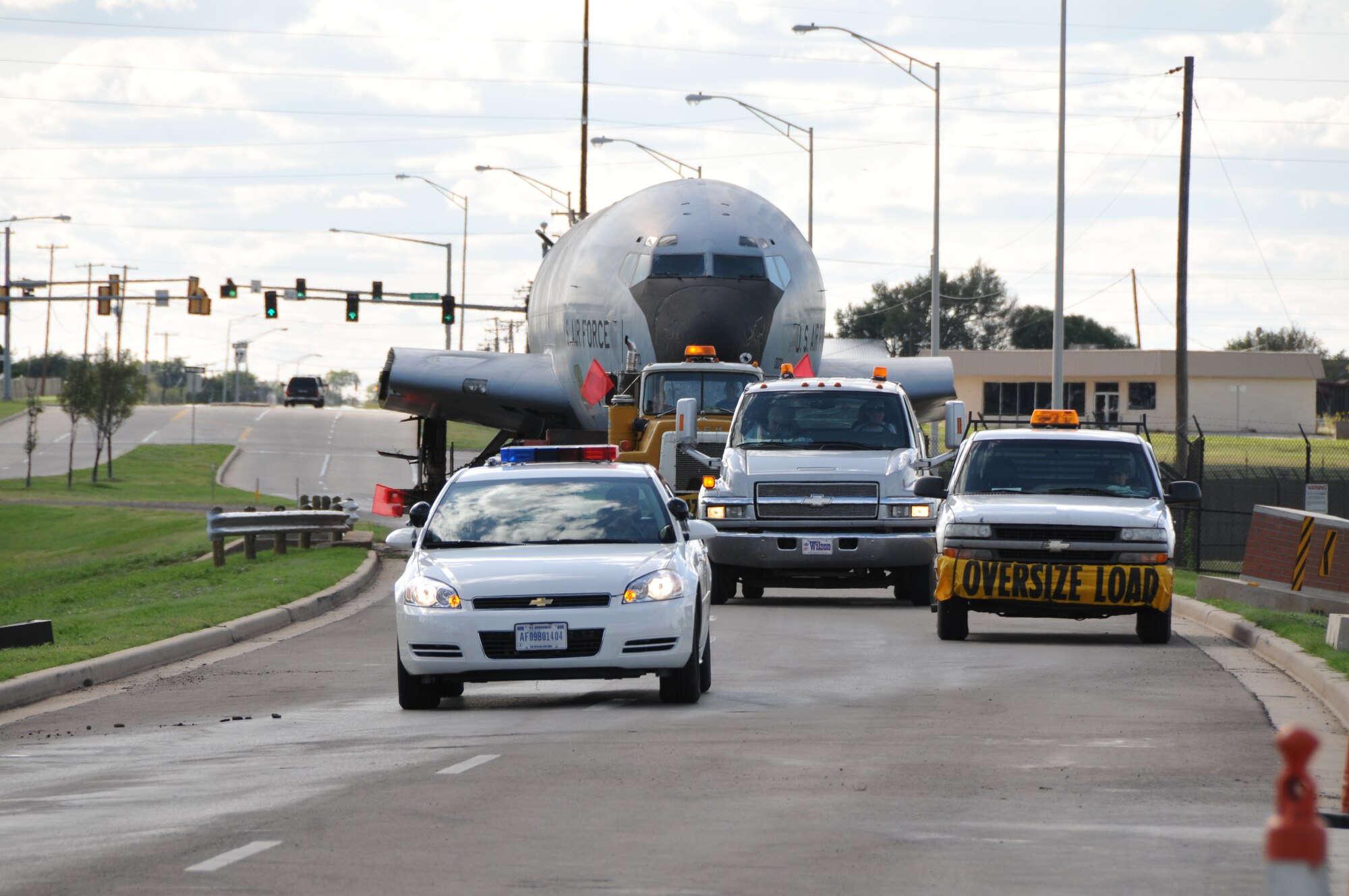 ALTUS AIR FORCE BASE, Okla. -- A KC-135A Stratotanker makes its way through the main gate Sept. 22. The KC-135A 58-0070 was the last completely intact model outside the National Museum of the Air Force system until being accessioned prior to the transfer. It will be placed on static display next to the C-141 Starlifter at the Wings of Freedom Park. (U.S. Air Force Photo/Senior Airman Jennifer L. Flores)
