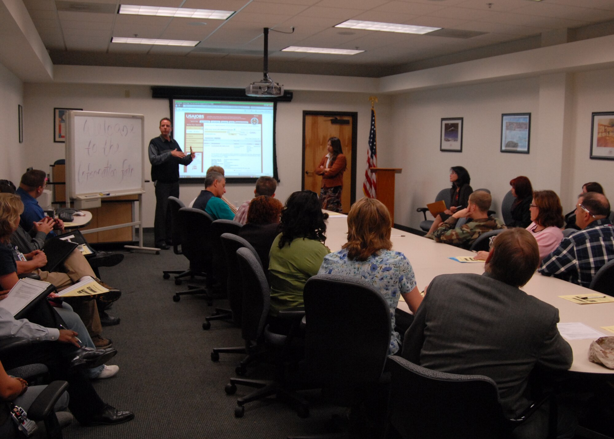 Civilian Personnel representatives Michael Hoene(left) and Michelle Lovate(right), explain the Air Force hiring process during the first of three Employment Education Fairs Sept. 30. The Employment Information Fair was held to explain the job application process through the USA Jobs Web site to participants. Additional Employment Information Fairs will be held Oct. 7 and 14 in the 95th Air Base Wing Headquarters. The fair is open to anyone with access to the base. (Air Force photo/Airman 1st Class William A. O'Brien)