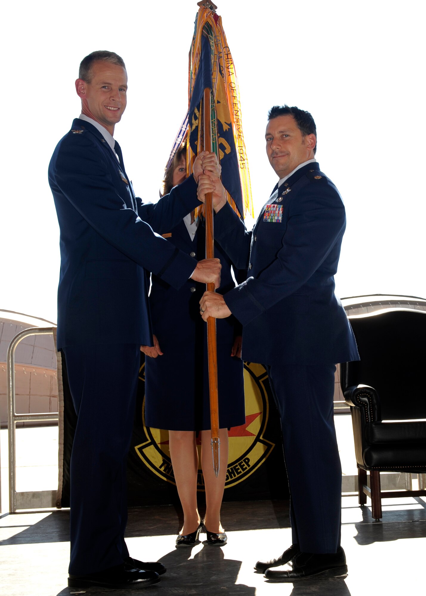 HOLLOMAN AIR FORCE BASE, N.M. -- Col. Michael Stapleton, 49th Operations Group commander, passes a guidon to Lt. Col. Craig Baker, as he assumes command of the 8th FS in a ceremony here Sept. 25. The 8th FS, known historically as "The Black Sheep," will resume operations after a brief period of inactivity associated with the F-117A Nighthawk retirement. The squadron will be the second F-22A Raptor squadron, along with the 7th Fighter Squadron, to be assigned to the 49th Fighter Wing here. Both squadrons are to receive 20 F-22s and aircraft will be identifiable by their tail flash of either the "Black Sheep" or "Screamin' Demons." (U.S. Air Force photo by Senior Airman Tiffany Trojca)