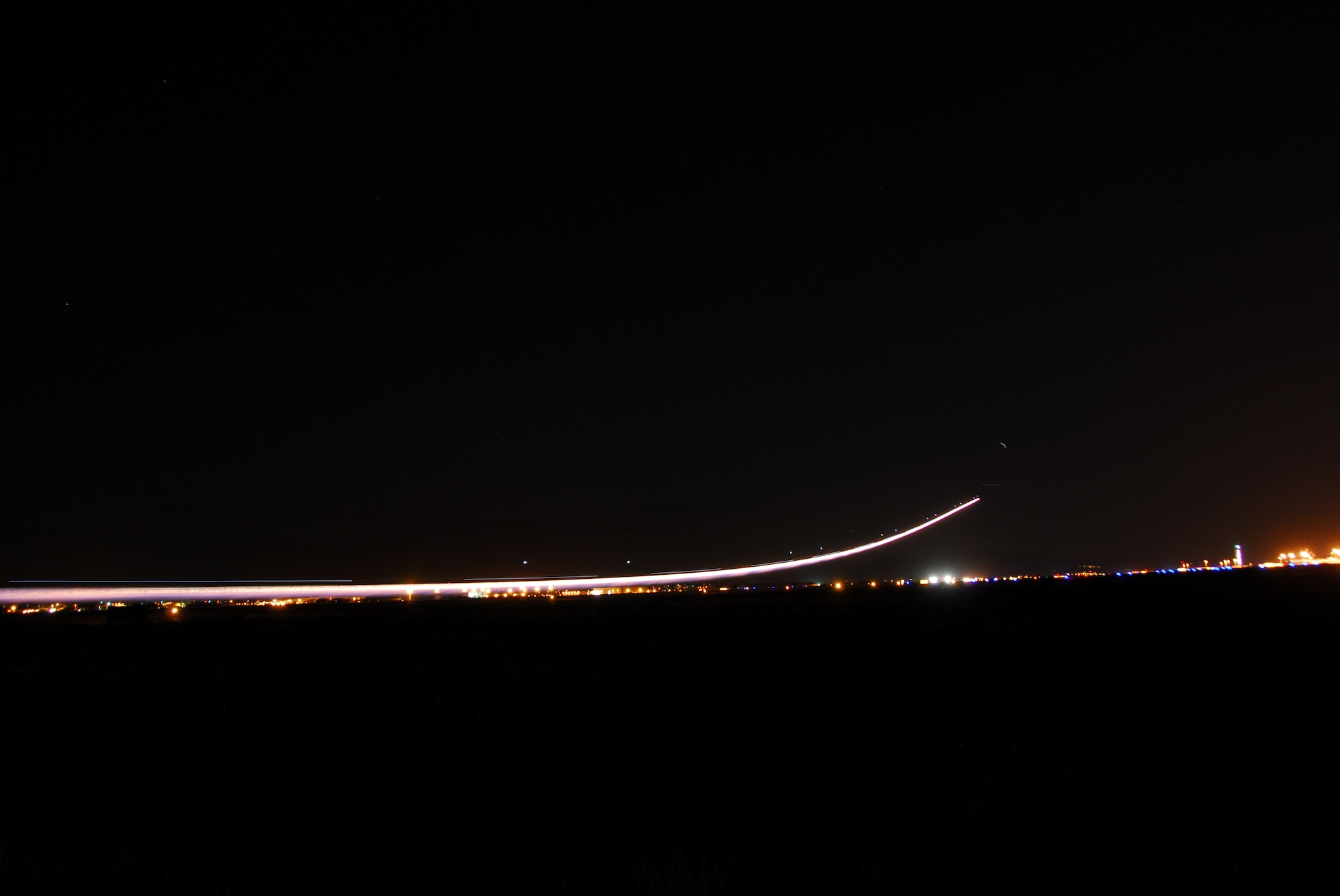 With afterburner blazing, an F-16E, Block 60, takes off from Tucson International Airport into the night sky. (Air National Guard photo by Master Sgt. Dave Neve)