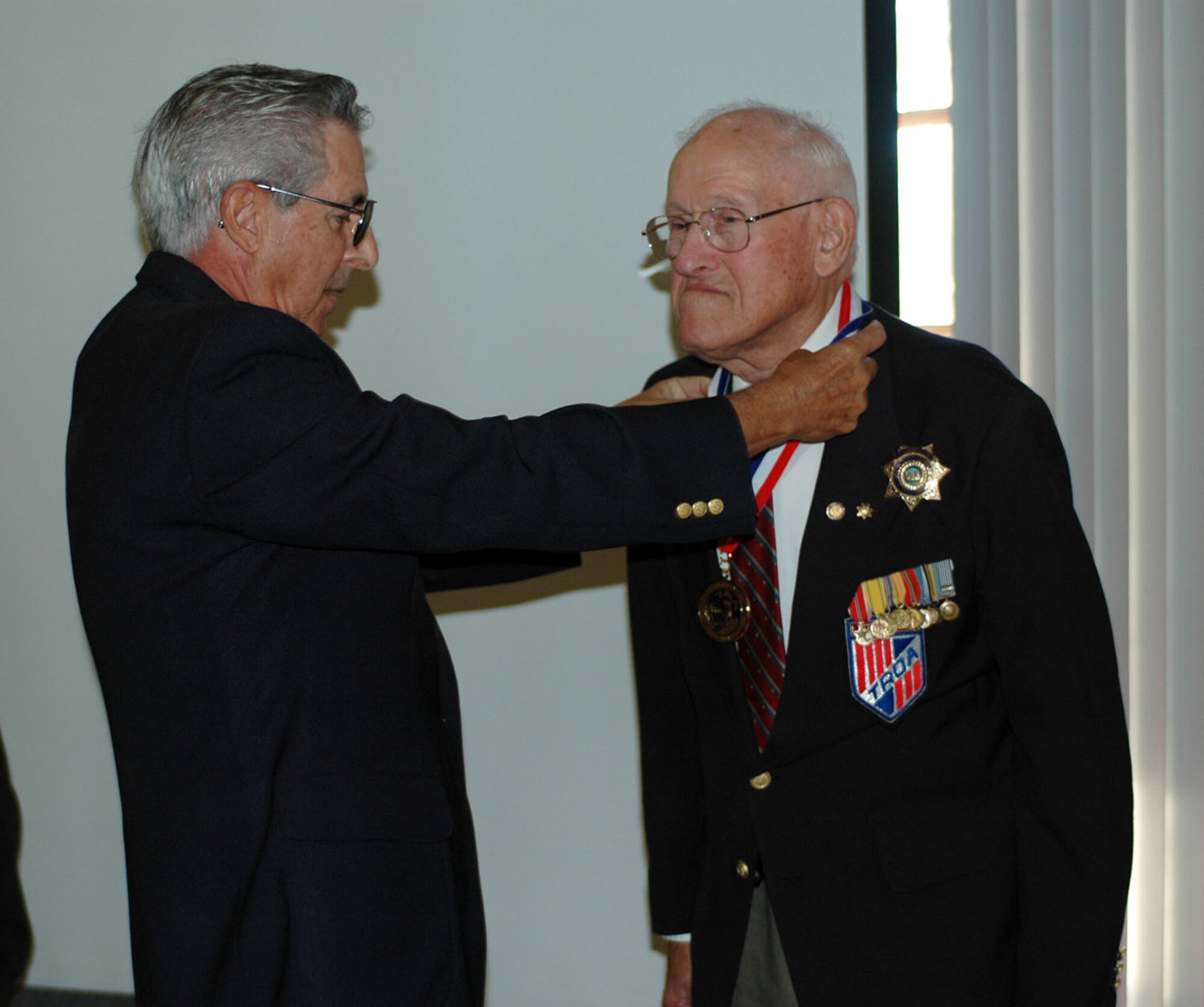 Prior enlisted, Lt. Col. (Ret) Philip Edelman receives the Non-Commissioned Officers Association World War II Legacy Award from Lt. Col. (Ret) Thomas Di Giorgio, Military Officers Association of America Solano County Chapter president, Sept. 24 at the Travis Conference Center.  Colonel Edelman was one of three World War II presented the award, which was given by the Society of Air Force Nurses, Inc. 
Lieutenant Colonel Clinton Hankins and Chief Warrant Officer Charles Hull also received the award, both of which are prior enlisted. 
“The Military Non-Commissioned Officer Legacy Award I received indicates the loyalty and service the NCOs have demonstrated throughout my military career,” said Colonel Edelman. “When a job ‘no matter what’ has to be accomplished, military officers depend on their NCOs to help get the job done.”
In addition to his service in WWII, Colonel Edelman also served in Korea and Vietnam and has earned a total of 19 medals including the Legacy Award. (U.S. Air Force photo/Senior Airman Kristen Rohrer)
