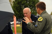 Lt. Gen. Harry M. Wyatt III, Director of the Air National Guard is given a tour of the MQ-9 Reaper on Hancock Field Air National Guard Base on 2 October by Lt. Col. Michael R. Smith, 138th Fighter Squadron Commander. The tour preceded the official ribbon cutting ceremony for the only MQ-9 Reaper Maintenance Field Training Detachment in the U.S. Air Force. (USAF Photo By: SSgt. James N. Faso II/RELEASED)