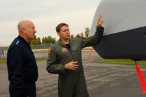 Lt. Gen. Harry M. Wyatt III, Director of the Air National Guard is given a tour of the MQ-9 Reaper on Hancock Field Air National Guard Base on 2 October by Lt. Col. Michael R. Smith, 138th Fighter Squadron Commander. The tour preceded the official ribbon cutting ceremony for the only MQ-9 Reaper Maintenance Field Training Detachment in the U.S. Air Force. (USAF Photo By: SSgt. James N. Faso II/RELEASED)