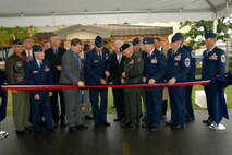 The assembled distinguished guests at the 174th Fighter Wing, Hancock Field Air National Guard Base, Syracuse, NY cut the ribbon and officially open the only MQ-9 Reaper Maintenance Field Training Detachment for the U.S. Air Force, Reserve and Air National Guard.
(From L to R) Brig. Gen. James Kwiatowski, Assemblyman Al Stirpe, Brig. Gen. (Ret.) Curtis Irwin, Sen. Dave Valesky, Maj. Gen. (Ret.) Robert A. Knauff, Congressman Dan Maffei, Maj. Gen. (Ret.) Paul Schemp, Lt. Gen. Harry M. Wyatt III, Maj. Gen. (Ret.) Thomas P. Maguire, MG Joseph Taluto, Col. Anthony B. Basile, Col. Kevin W. Bradley, Assemblyman Will Barclay, Chief Master Sgt. Muncy, Chief Master Sgt. Hardy Pierce, Chief Master Sgt. David Heckman. (USAF Photo By: SSgt. James N. Faso II/RELEASED)
