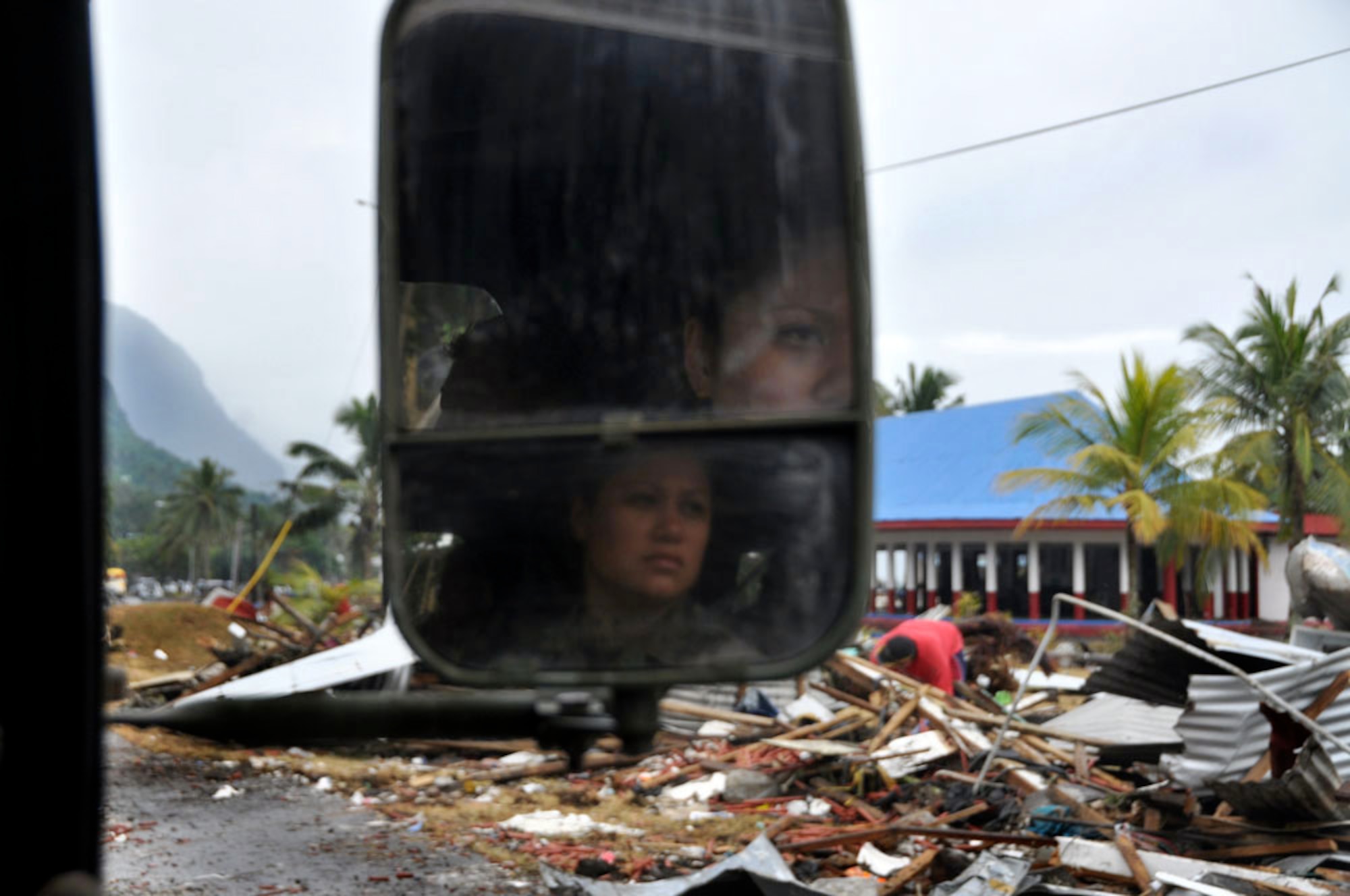 Tech. Sgt. Carissa Maxson studies the shoreline of Pago Pago, American Samoa, Oct. 1, 2009, while conducting assessments of the area after a tsunami stuck there Sept. 29. Sergeant Maxson is with the Air National Guard's 154th Medical Group's chemical, biological, radiological/nuclear and explosives enhanced response force package. (U.S. Air Force photo/Tech Sgt. Cohen A. Young) 
