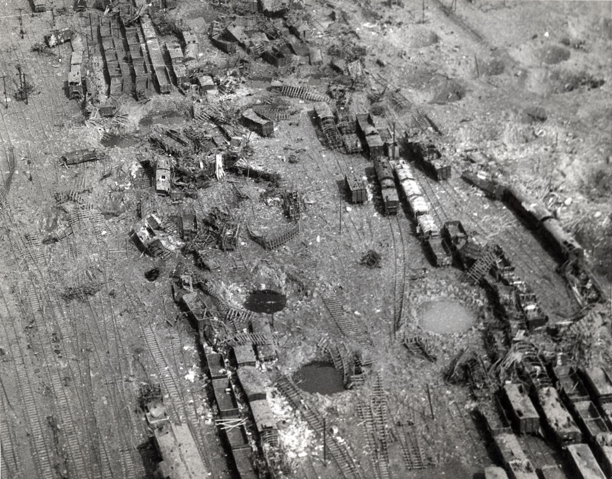 Railroad yard near Limburg, Germany, struck by 9th Air Force light and medium bombers on Dec. 23, 1944, the first day of good weather during the Battle of the Bulge. Unfortunately, since the rail cars were not marked per the Geneva Convention, Allied POWs in transit sometimes lost their lives in rail attacks. (U.S. Air Force photo)
