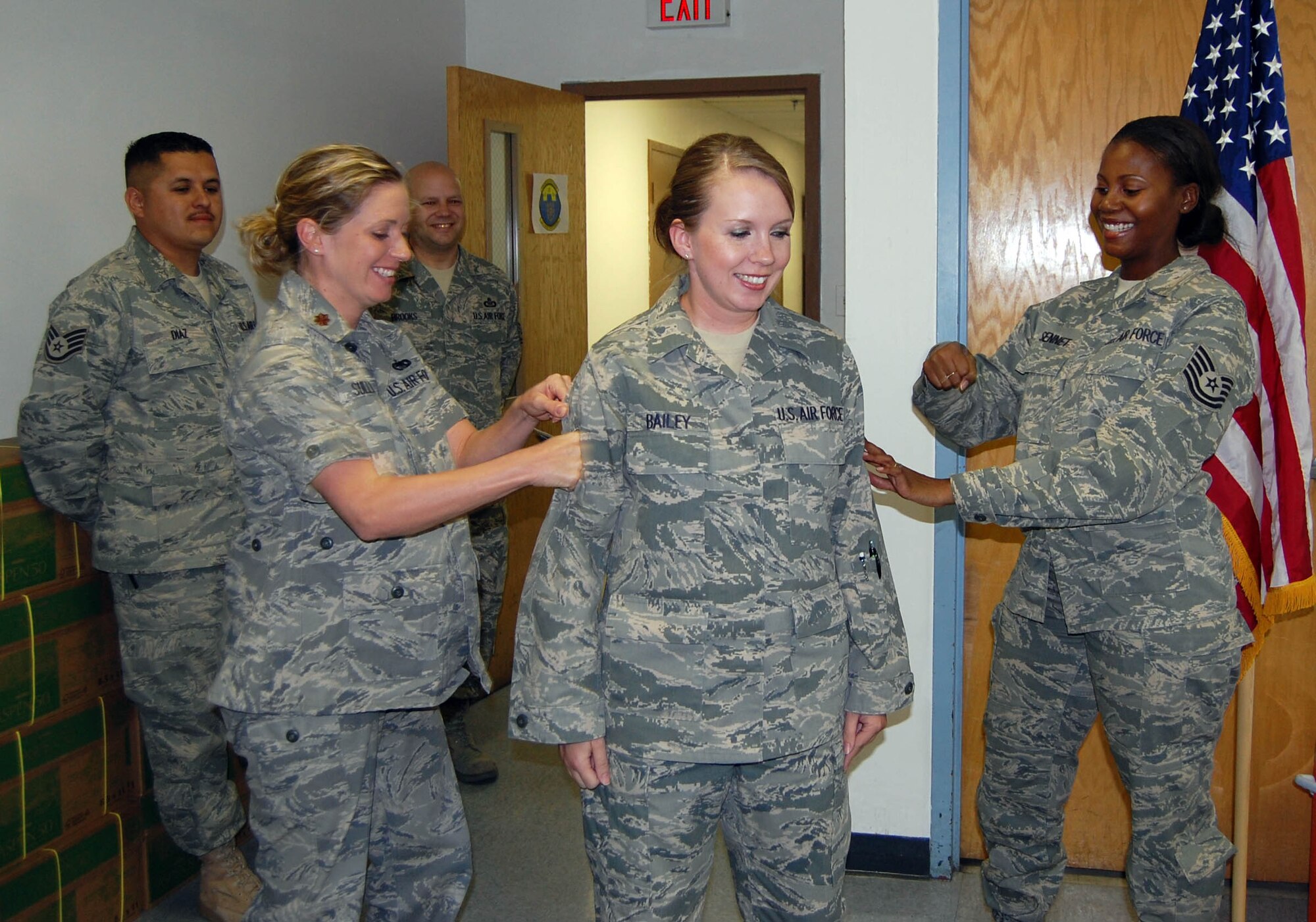 Tech. Sgt. Amy Bailey, 926th Mission Support Squadron (middle), is pinned on by her supervisor, Tech. Sgt. Vickie Sennet (right) and Maj. Dana Sullivan during her Promotion Enhancement Program ceremony here Sept. 30. Sergeant Bailey was the one applicant out of 11 nominated at 10th Air Force to be selected for the early promotion.