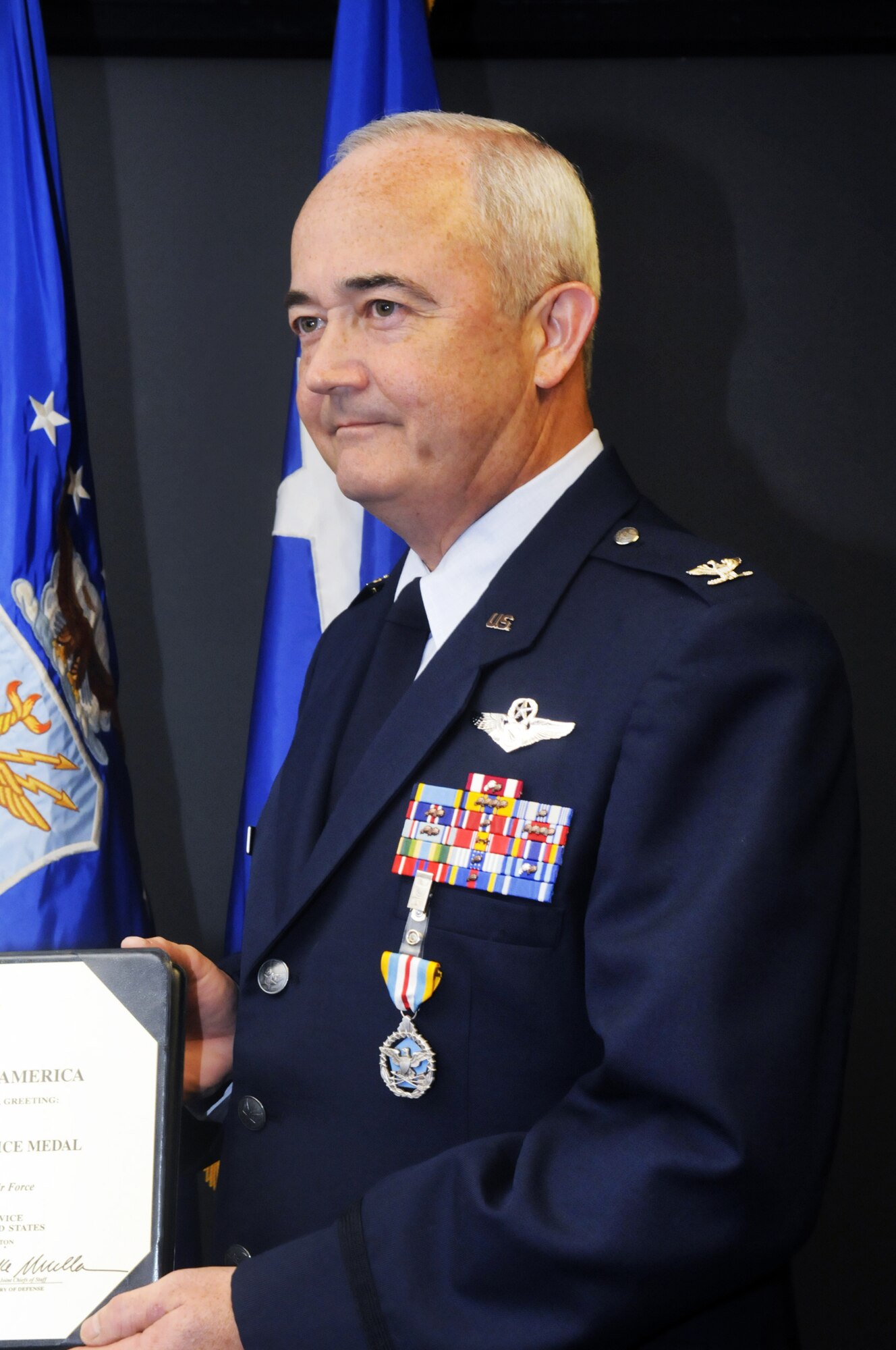 Col. John A. Cote was awarded the Defense Superior Service Medal in a presentation by Maj. Gen. Polly Peyer Sept. 29. U. S. Air Force photo by Sue Sapp
