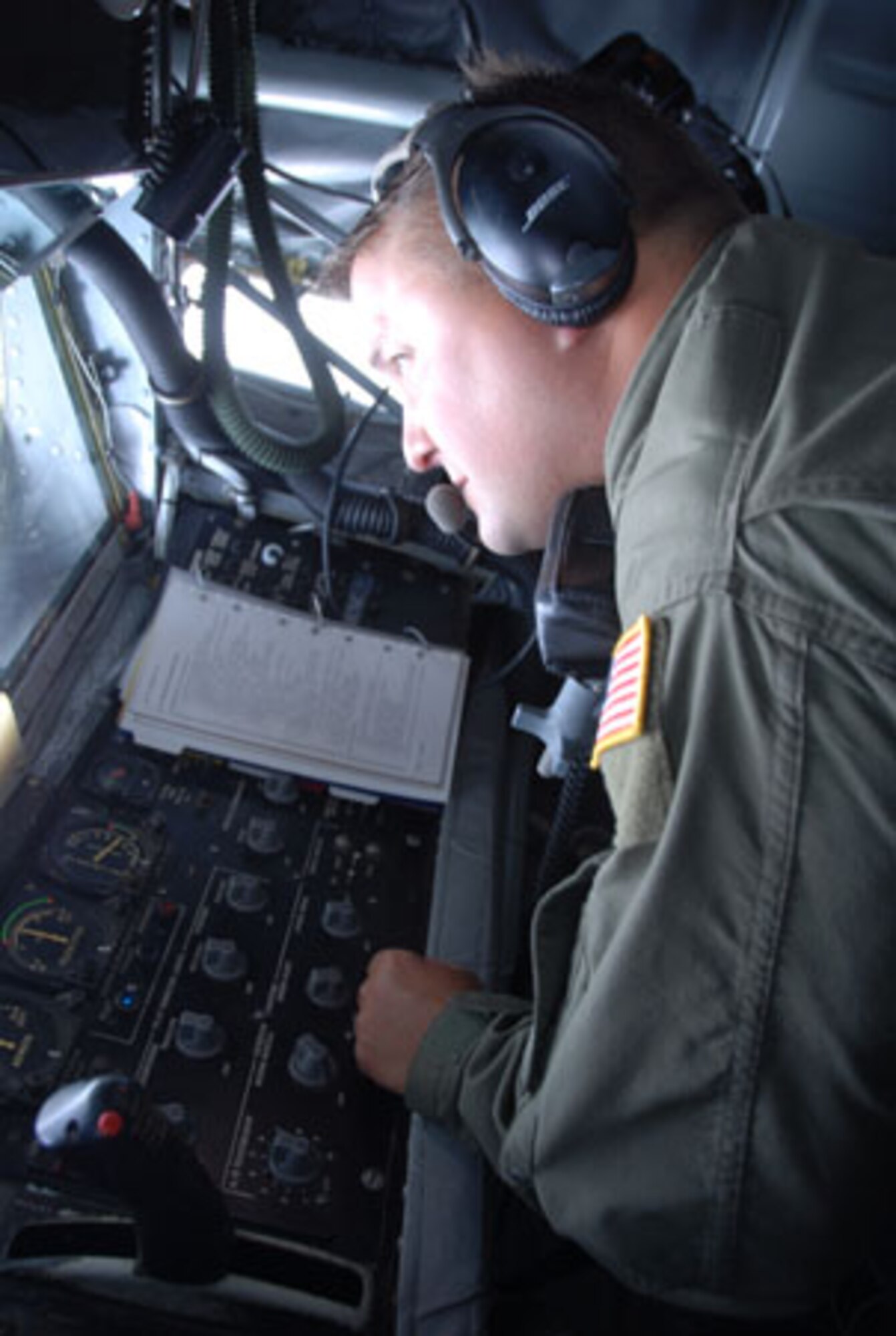 SCOTT AIR FORCE BASE, Ill. -- Tech Sgt. JL Smith, an in-flight refueling specialist with the 906th Air Refueling Squadron, prepares to refuel an RC-135 from a KC-135R Stratotanker. The flight on Sept 9 marked the first time that an all Active Duty crew flew planes owned and maintained by the 126th Air Refueling Wing, Illinois Air National Guard, Scott Air Force Base, Ill. (U.S. Air Force photo by Master Sgt. Ken Stephens) 


