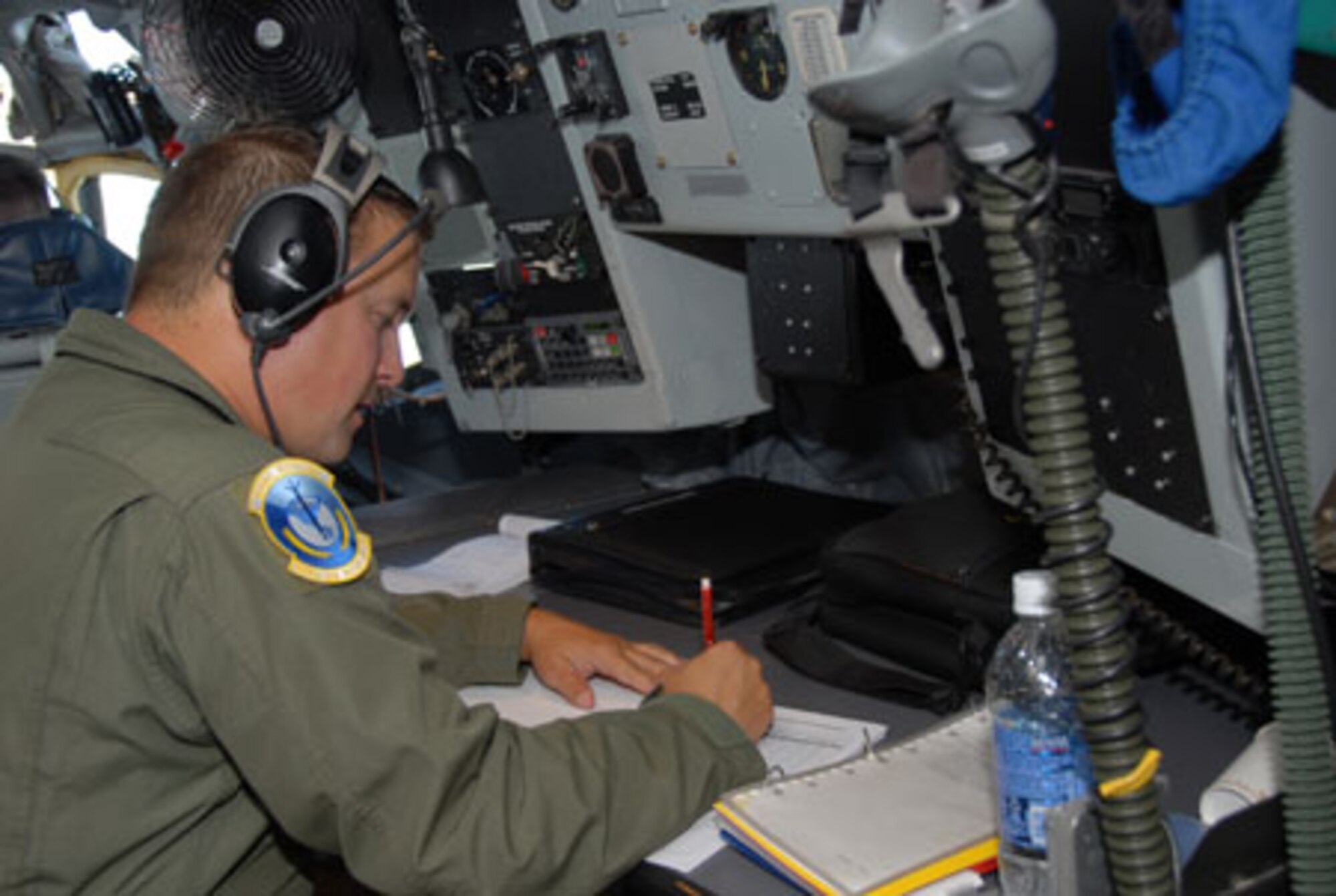 SCOTT AIR FORCE BASE, Ill. -- Tech. Sgt. JL Smith, an in-flight refueling specialist with the 906th Air Refueling Squadron, prepares for a mission aboard a KC-135R Stratotanker. The flight on Sept 9 marked the first time that an all Active Duty crew flew planes owned and maintained by the 126th Air Refueling Wing, Illinois Air National Guard, Scott Air Force Base, Ill. (U.S. Air Force photo by Master Sgt. Ken Stephens) 



