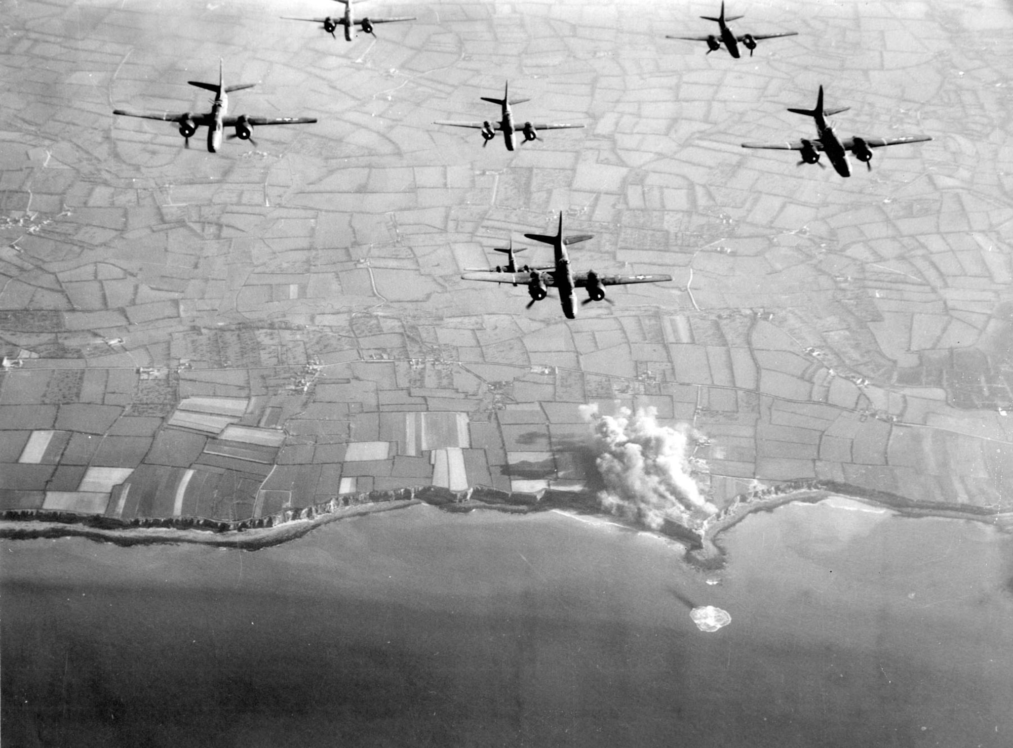 A-20 light bombers strike the Pointe du Hoc strongpoint in Normandy in May 1944. (U.S. Air Force photo)