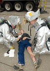 US Air Force Staff Sgt. Christopher A. Wood reads the injured individual’s status card at Hancock International Airport in Syracuse, N.Y. on 12 Sept 2009. Wood was participating in the Airport's emergency exercise. (US Air Force photo by Staff Sgt. Ricky J Best/ RELEASED)