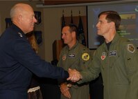 Lt. Gen. Harry M. Wyatt III, Director of the Air National Guard greets Col.  Greg A. Semmel, 174th Operations Group Commander at Hancock Field Air National Guard Base in Syracuse N.Y. on 2 October 2009. Lt. Gen. Wyatt visited the base for the grand opening of the new MQ-9 Reaper Maintenance Field Training Detachment. (US Air Force photo by Staff Sgt. Ricky J Best/ RELEASED)