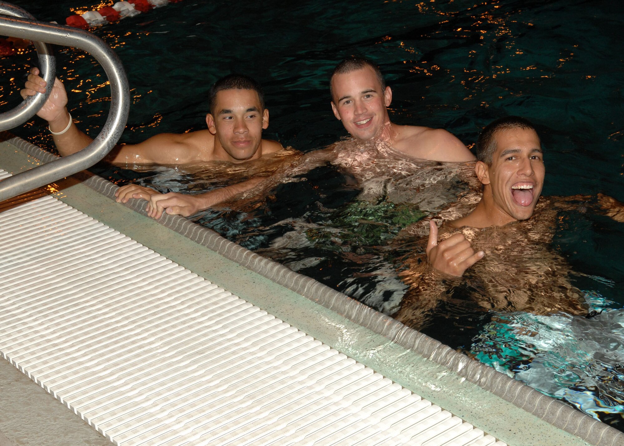 Airman Matthew Marquez, Airman 1st Class Elliot Meyer and Airman 1st Class Julio Arteaga, all from the 355th Civil Engineer Squadron, take a swim at the outdoor pool here Sept. 25 as part of the Summer Splash 2009 event. The event, which attracted more than 75 Airmen, was sponsored by the Culture of Responsible Choices, and marked the end of the summer season and the closing of the outdoor pool. CoRC is a program that emphasizes personal responsibility and accountability for decision-making and behavior on and off duty. (U.S. Air Force photo/Airman Jerilyn Quintanilla) 