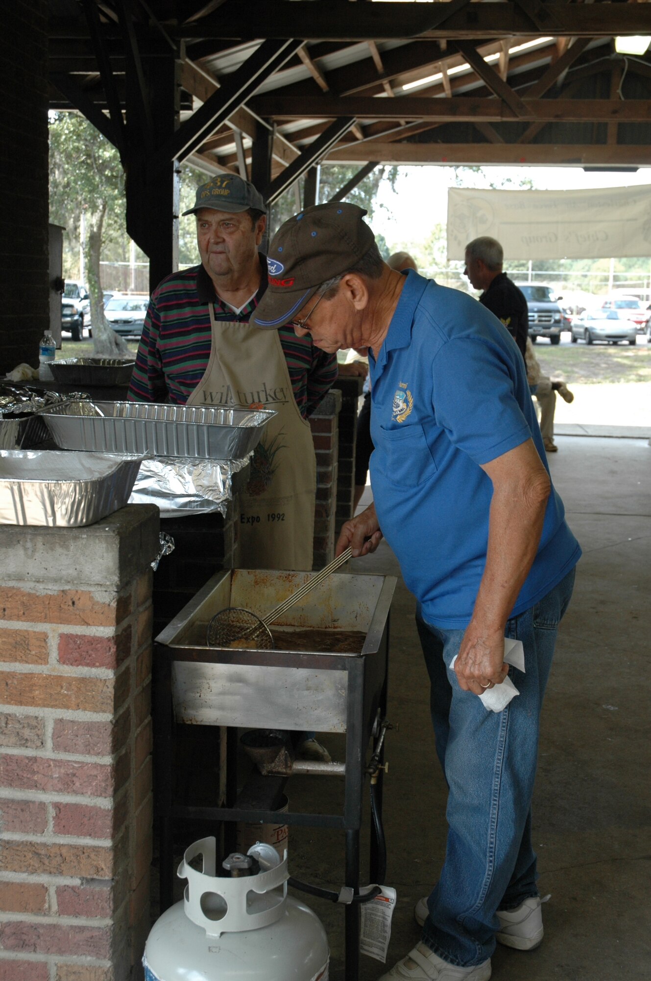Colonel Steven Chapman, 315th Airlift Wing commander, Charleston Air Force Base, S.C., enjoys lunch with Major Dave Cooksey, a member of the 315 Aircraft Maintenance Squadron at the semi-annual Chief’s Fish Fry here today.  The Charleston Chief's Group has had a cookout fundraiser twice a year for the last 24-years. Money raised from the event will be distributed back to Team Charleston's Airmen through programs that the Chief's Group supports. (U.S. Air Force photo/Tanya Koch)
