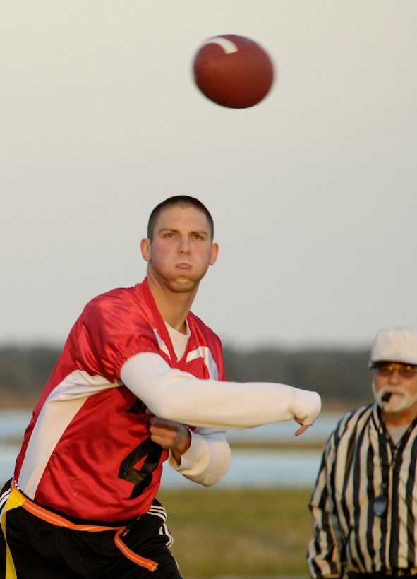 LANGLEY AIR FORCE BASE, Va. -- Douglas Grabowski, quarterback for the 1st Medical Group flag football team, passes the football to a receiver downfield during a game against the 1st Security Forces Squadron Oct. 1. The 1st MDG clinched the win, 13-6. (U.S. Air Force photo by Staff Sgt Jeff Nevison)
