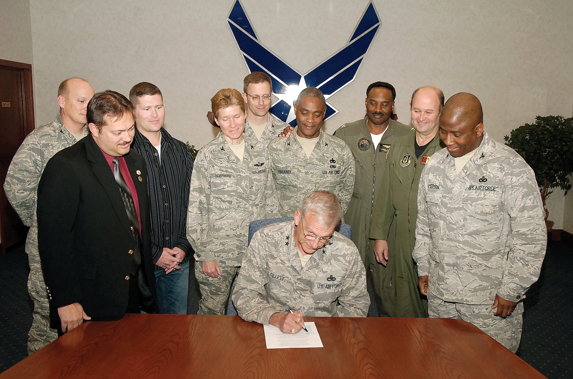 From left to right: Col. Kelly Larson, Defense Logistics Agency Oklahoma City commander; Todd Lambert, International Association of Firefighters F211 Union president; James Schmidt, AFGE Local 916 Union president; Col. Patricia Hoffman, 552nd Air Control Wing commander; Col. Mark Beierle, 327th Aircraft Sustainment Wing commander; Col. Joseph Pinckney, 448th Supply Chain Management Wing vice commander; Navy Capt. Dwight Shepherd, Strategic Communications Wing ONE commander; Col. Jeffery Glass, 507th Air Refueling Wing commander; and Col. Allen Jamerson, 72nd Air Base Wing commander; look on as Maj. Gen. David Gillett, Oklahoma City Air Logistics Center commander, signs an Energy Awareness Month proclamation. A copy of the proclamation is available on Page 18. To participate in your own event, cut it out, post it and sign it. (Air Force photo by Kelly White) 