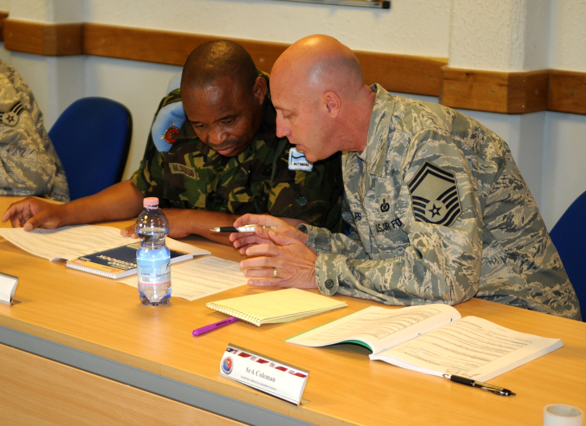 Botswana Forces Military Command Sergeant Major Mogakolodi Sebego (left) and Senior Master Sgt. J. Lee Phillips view course material at the Airman Leadership School here Sept. 22. (USAF photo by Master Sgt. Jim Fisher) 
