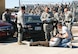 Members of the 552nd Air Control Wing observe as Security Forces Airmen and emergency medical personnel respond to a staged drunk driving accident on base.  As part of the 552nd Air Control Wing’s Safety Day, the Junior Enlisted Council sponsored an enactment of a DUI car accident to help members of the wing internalize the grave consequences of driving under the influence. (Air Force photos by 1st Lt. Kinder Blacke)