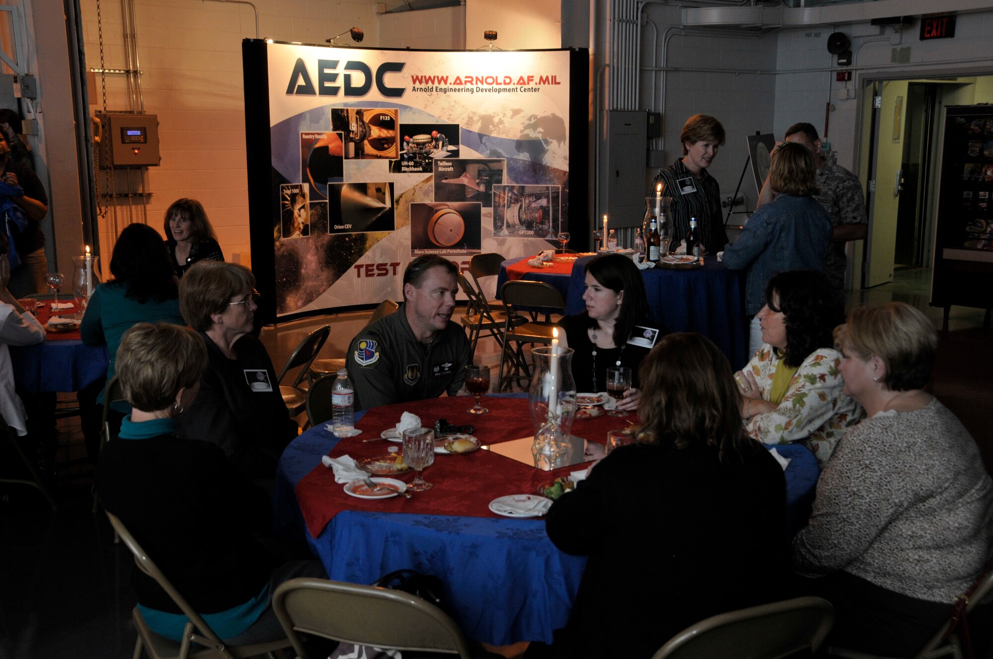 Arnold Engineering Development Center Commander Col. Michael Panarisi converses with elementary, middle and high school teachers from Franklin, Coffee and Moore counties in the lobby of the Mark I Space Chamber facility on Tuesday during Evening at Arnold, an event providing the guests with a base tour and dinner in one of Arnold’s ground testing facilities. (Photo by Rick Goodfriend)
