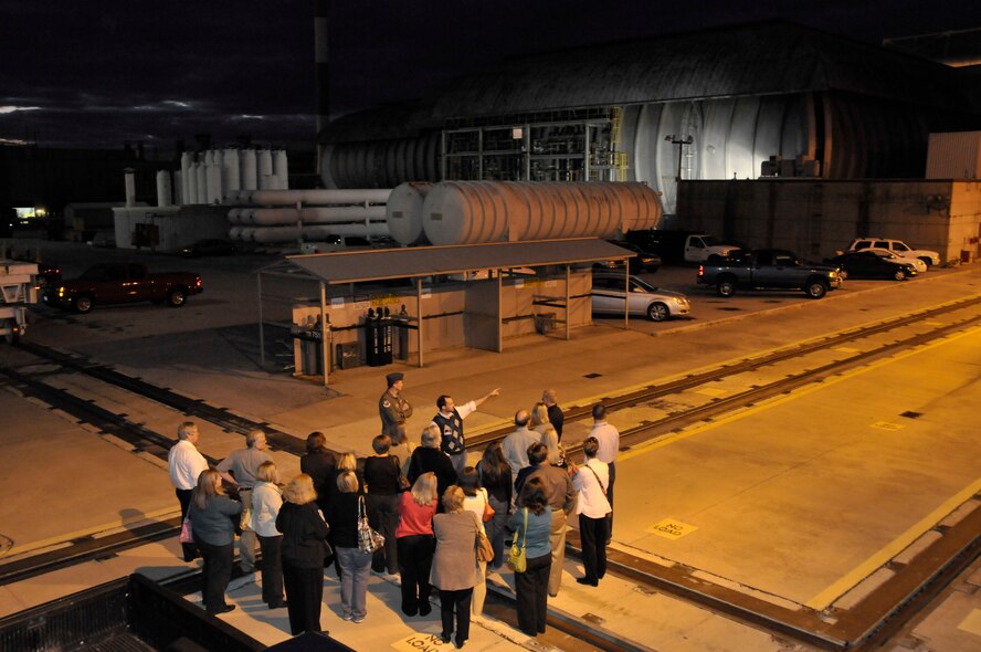 AEDC Public Affairs Director Joel Fortner talks about how a test model is moved into a test section of the Propulsion Wind Tunnel. (Photo by Rick Goodfriend)