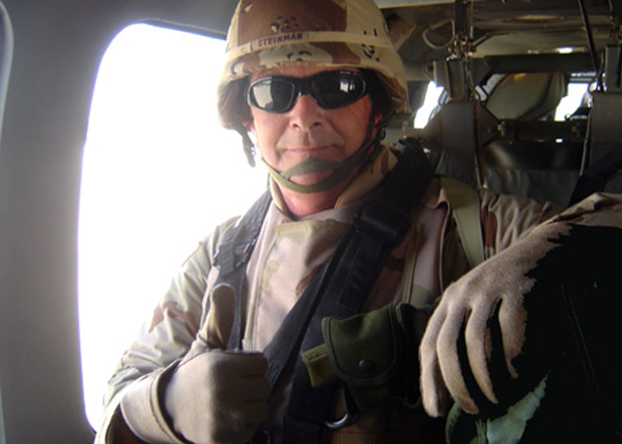 Hal Steinman, from the 38th CEG, sits on board a U.S. Army UH-60 helicopter during an Air Force communications assessment inspection to identify shorfalls and vulnerabilities for AFCENT in 2005. (Courtesy photo) 