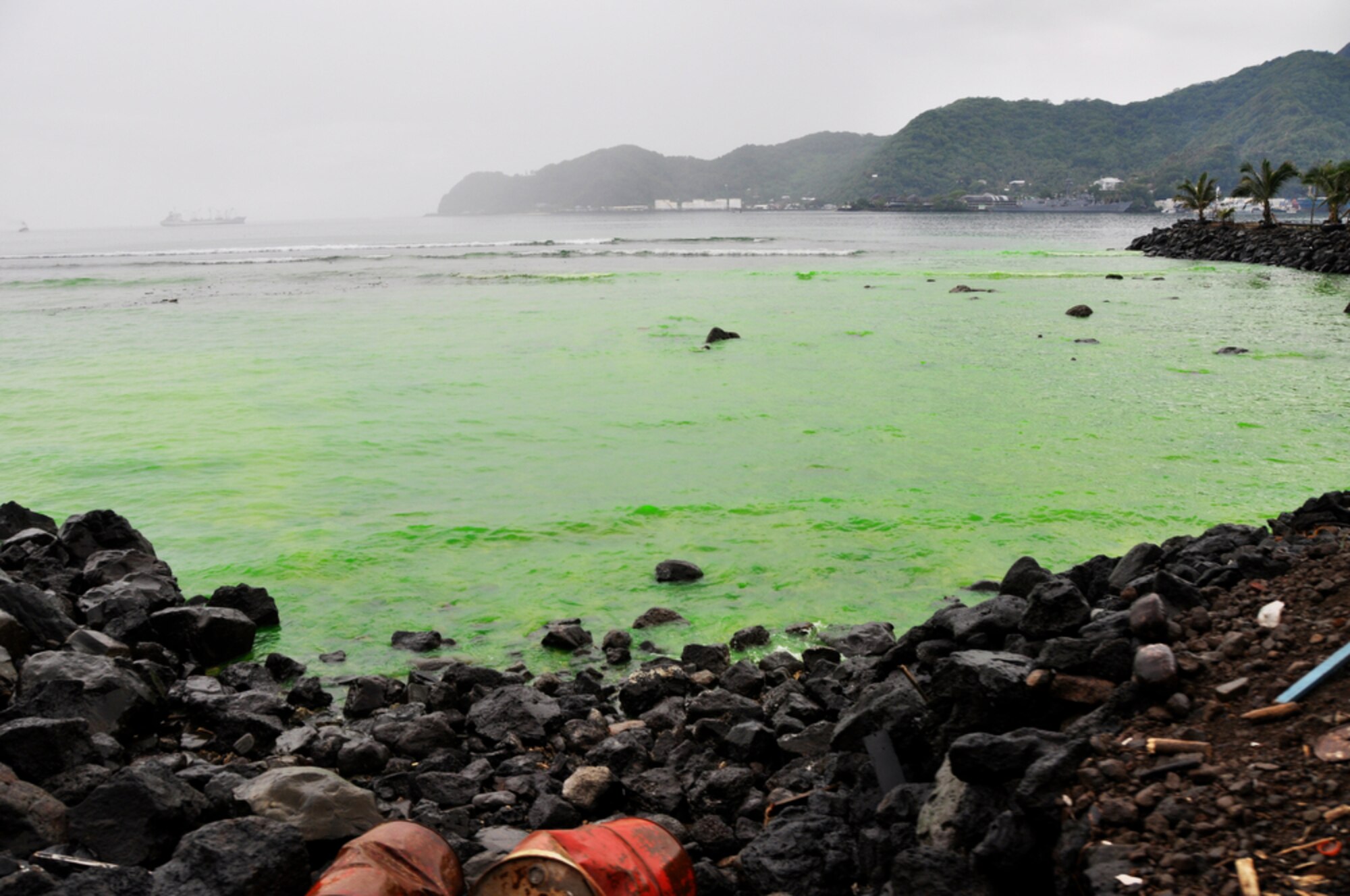 A contaminated area of the shoreline areas has turned green as of Oct. 1, 2009, in Pago Pago, American Samoa. The island nation was struck Sept. 29 by an 8.3 magnitude earthquake generating 15-foot waves and destroying whole villages. (U.S. Air Force photo/Tech. Sgt. Cohen A. Young) 

