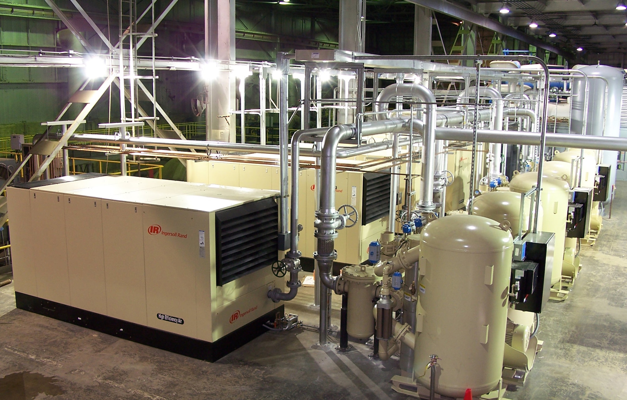 These five 300 horsepower compressors and three blower purge desiccant dryers were recently installed in the Engine Test Facility AC&T building as part of a multiyear, five phase project to repair Engine Test Facility service Air. (Photo by Fred Hutchinson)