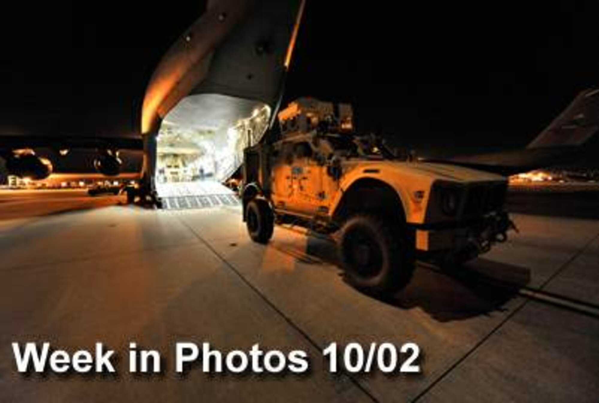 Air Force Week in Photos for Oct. 2 highlights photos from around the Air Force. In this photo by James M. Bowman, a new mine-resistant, ambush-protected armored all-terrain vehicle is loaded onto a C-17 Globemaster III bound for Afghanistan to support combat missions Sept. 30, 2009, at Charleston Air Force Base, S.C. (U.S. Air Force photo illustration) 