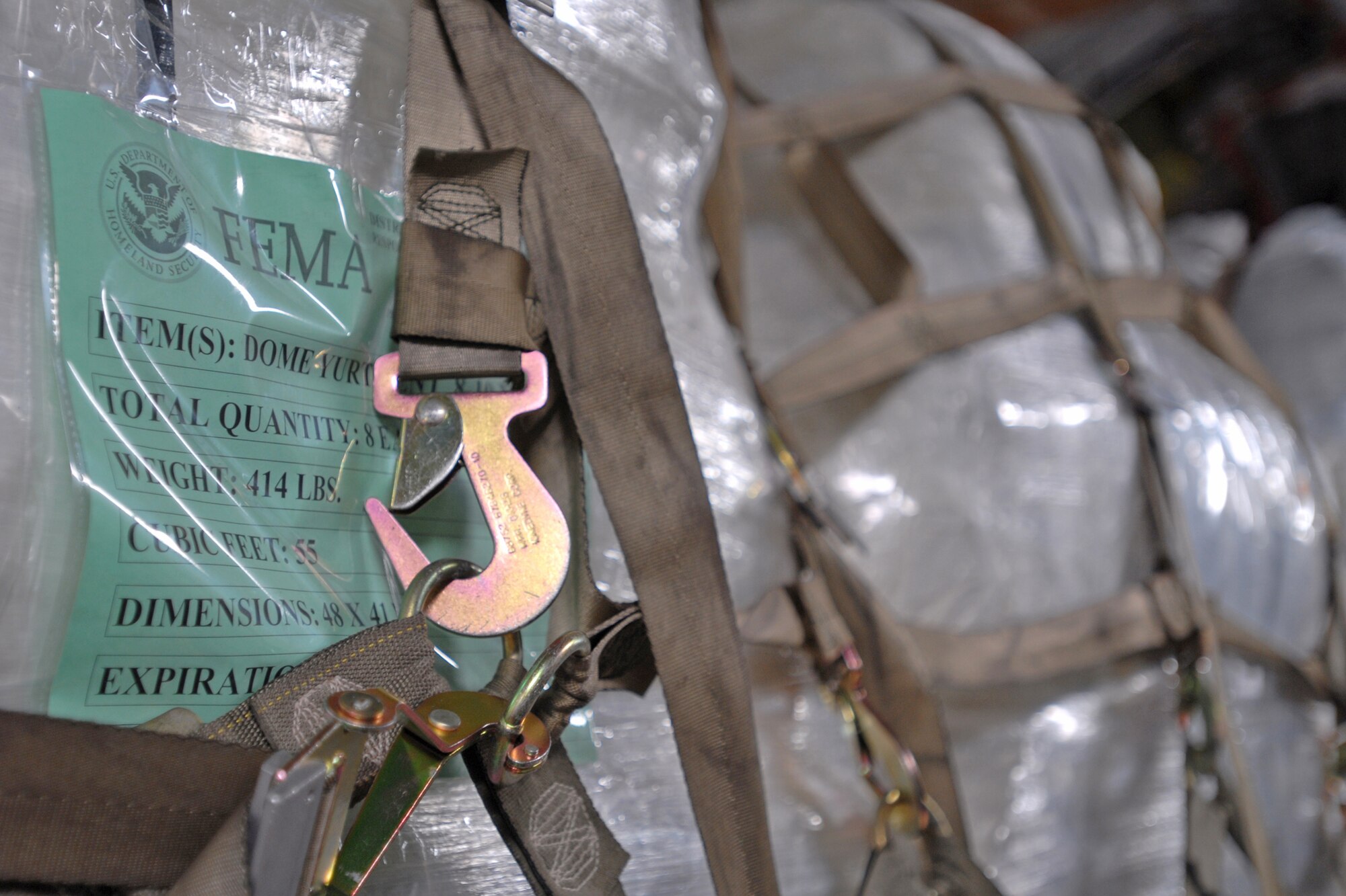 Humanitarian aid supplies from the Federal Emergency Management Agency is loaded by Hawaii Air National Guard, Hawaii National Guard and Hickam Air Force Base active-duty Airmen into a C-17 Globemaster III bound for American Samoa to assist in the relief efforts under way Sept. 30, 2009, at Hickam AFB, Hawaii. The efforts are in the wake of tsunamis triggered by an undersea earthquake Sept. 29 that has left more than 140 people dead in the South Pacific region. More than 90 Airmen and Soldiers deployed from Hawaii for the humanitarian mission. (U.S. Air Force photo/Staff Sgt. Mike Meares)
