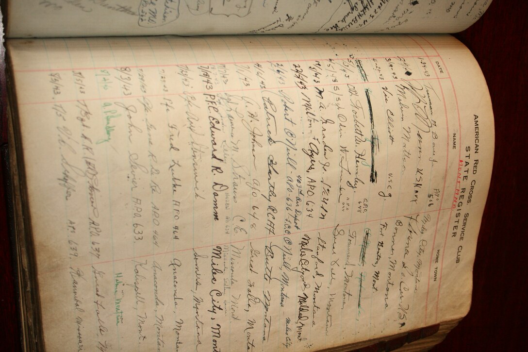 GLASGOW, United Kingdom - A rare book displaying signed names of Airman, Soldiers, Sailors and Marines from World War II was presented to be viewed by the first American military members since the war to the 501st Combat Support Wing Sept. 30 in Glasgow. The book was discovered by a city councillor recently.  (U.S. Air Force by Tech. Sgt. Kristina Barrett)